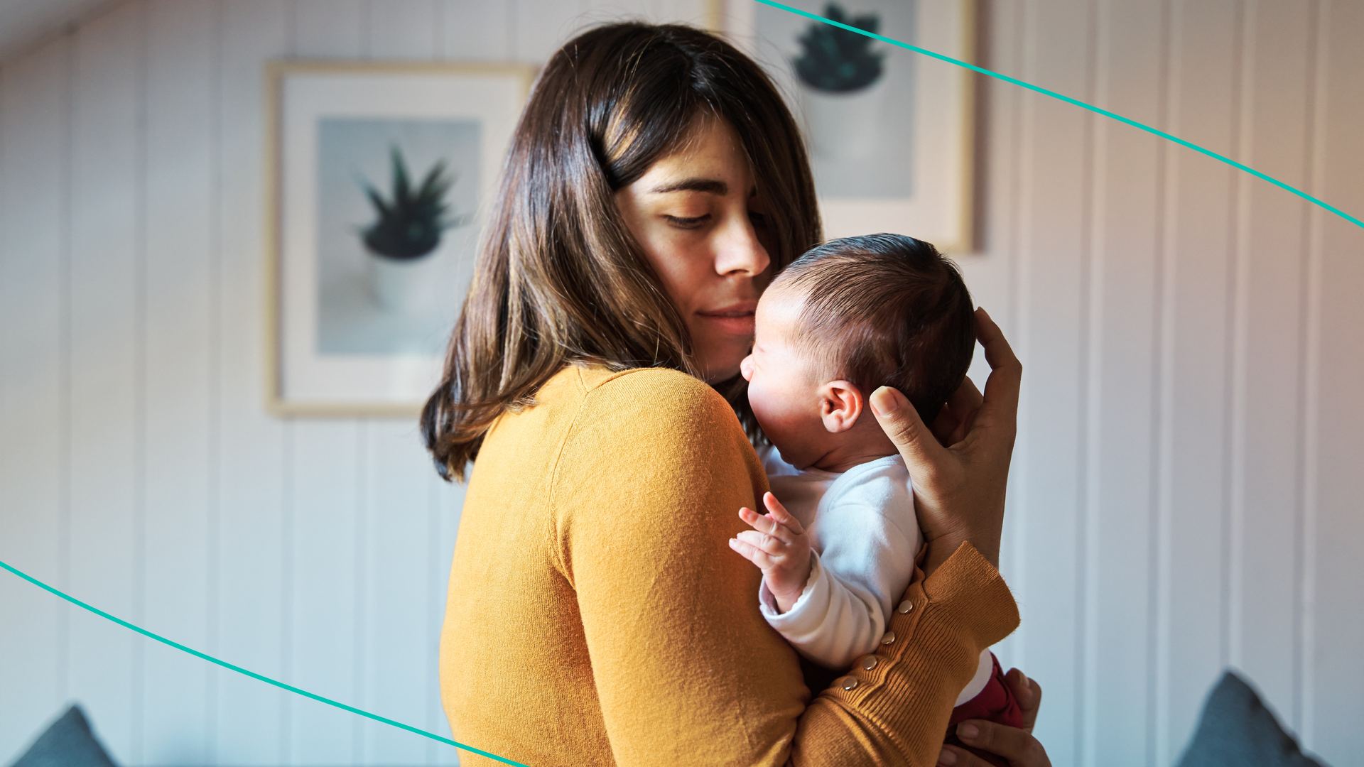 photo of woman holding newborn