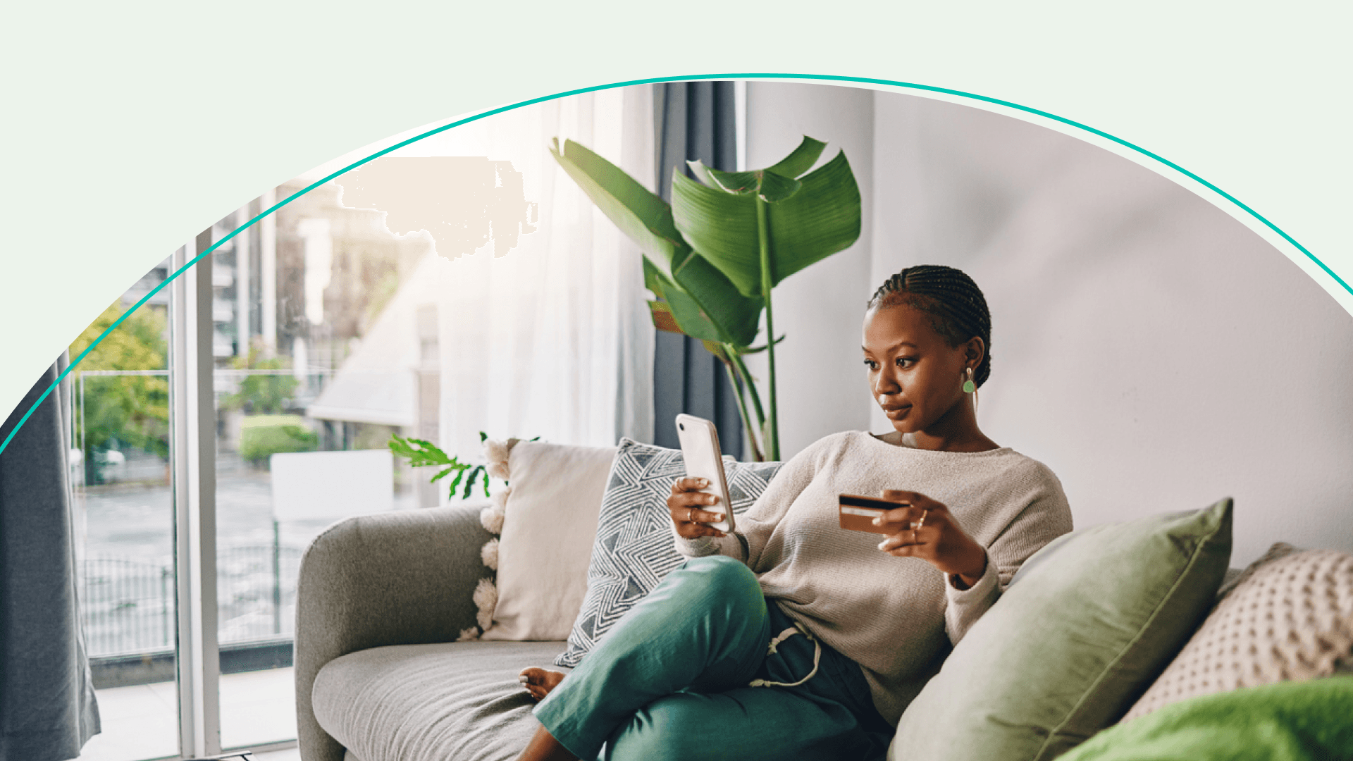 Woman holding phone and credit card