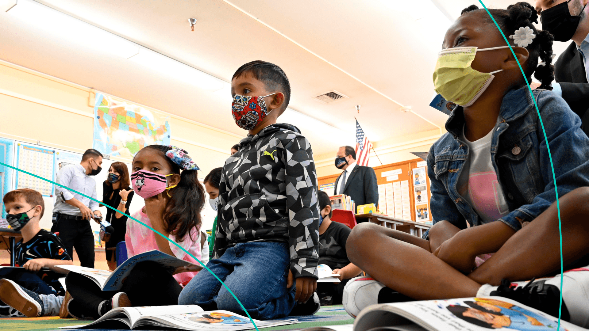 First graders listen to LAUSD interim Superintendent Megan Reilly read a book at Normont Elementary