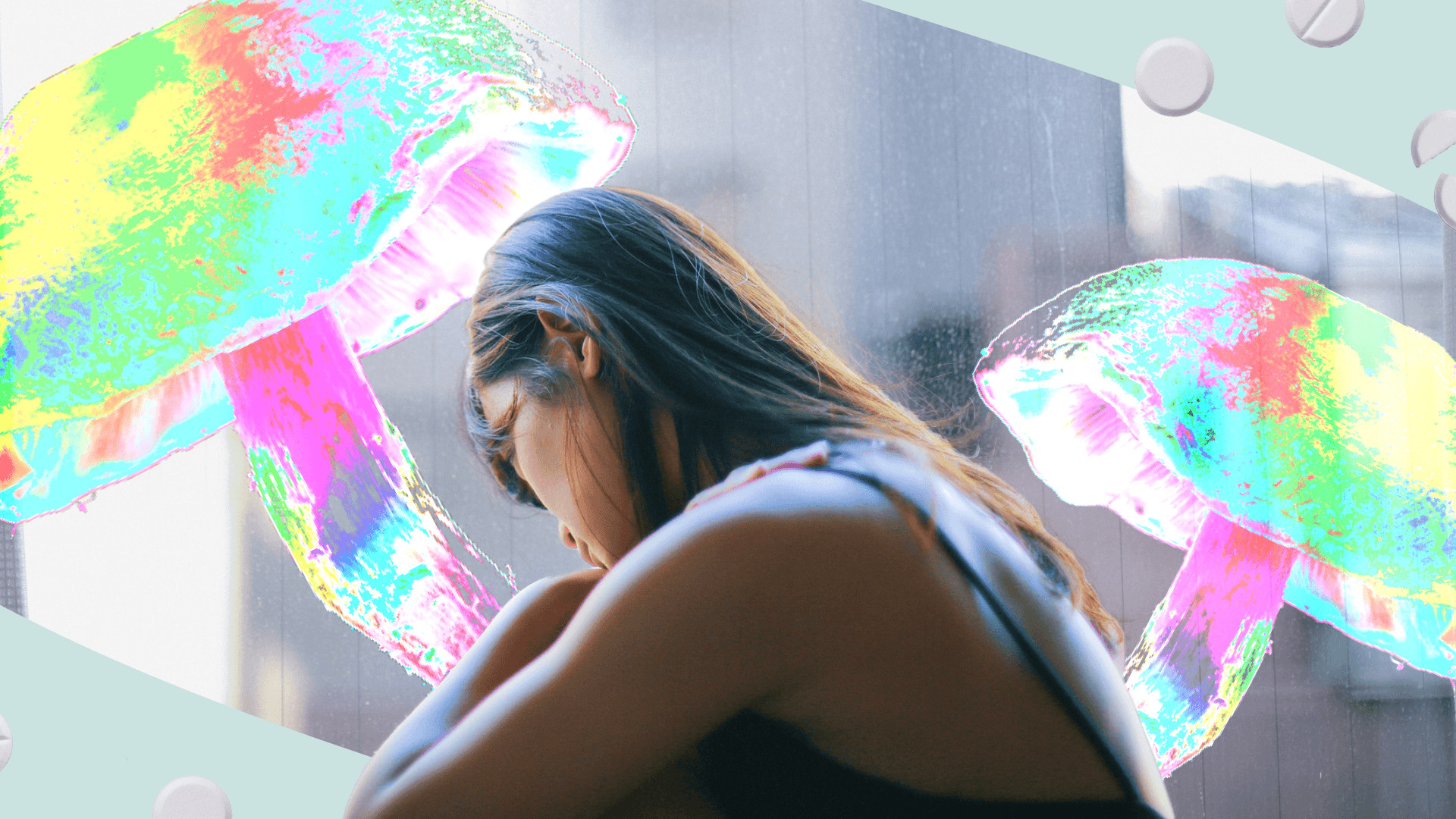 Woman sits facing away while technicolor mushrooms are in the background