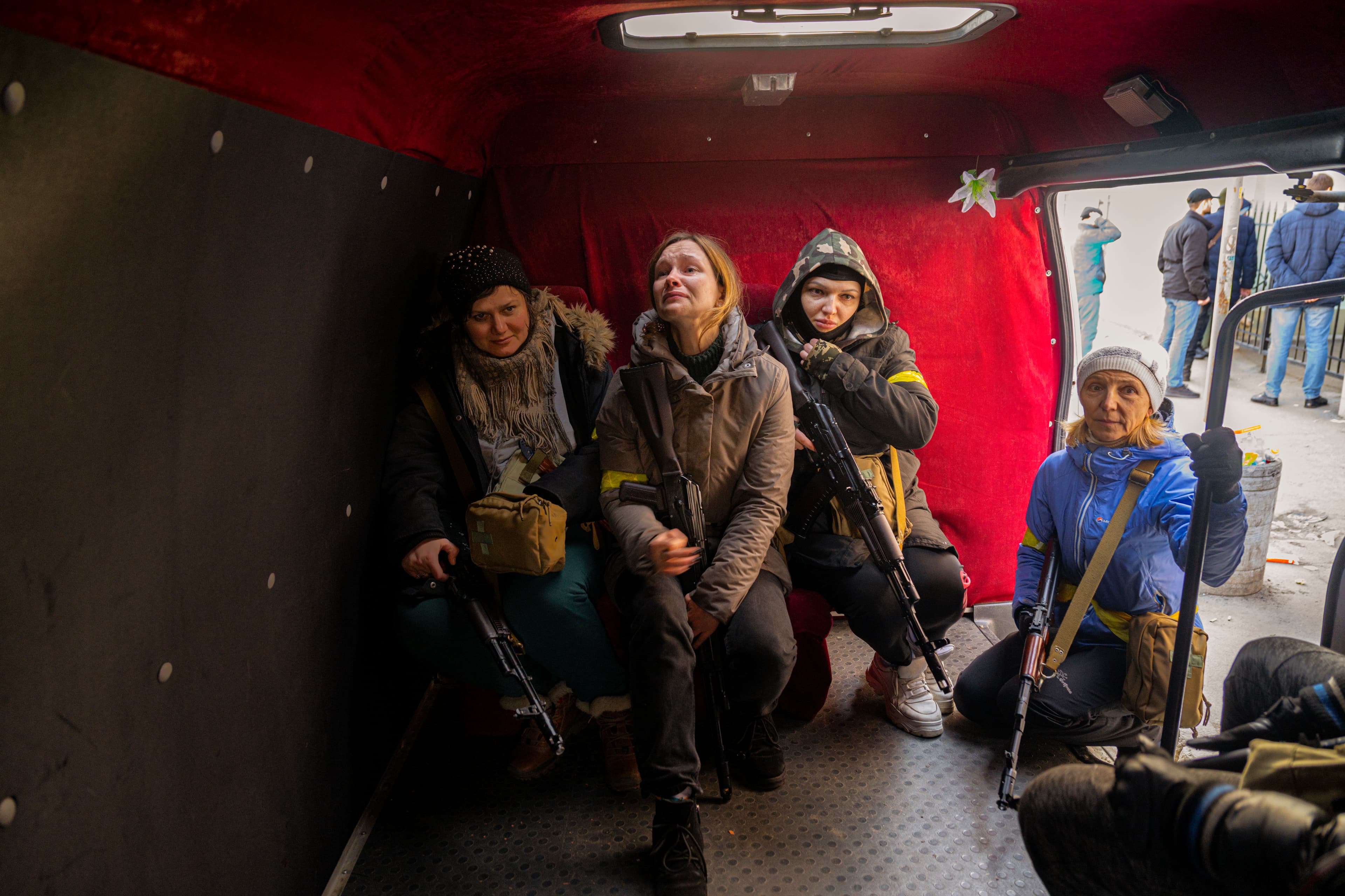 Yulya, 29, a teacher and Ukrainian volunteer, weeps in fear for her life as she waits to be transported to a center for volunteer fighters in Kyiv on February 26, 2022. Photo: © 2022 LYNSEY ADDARIO