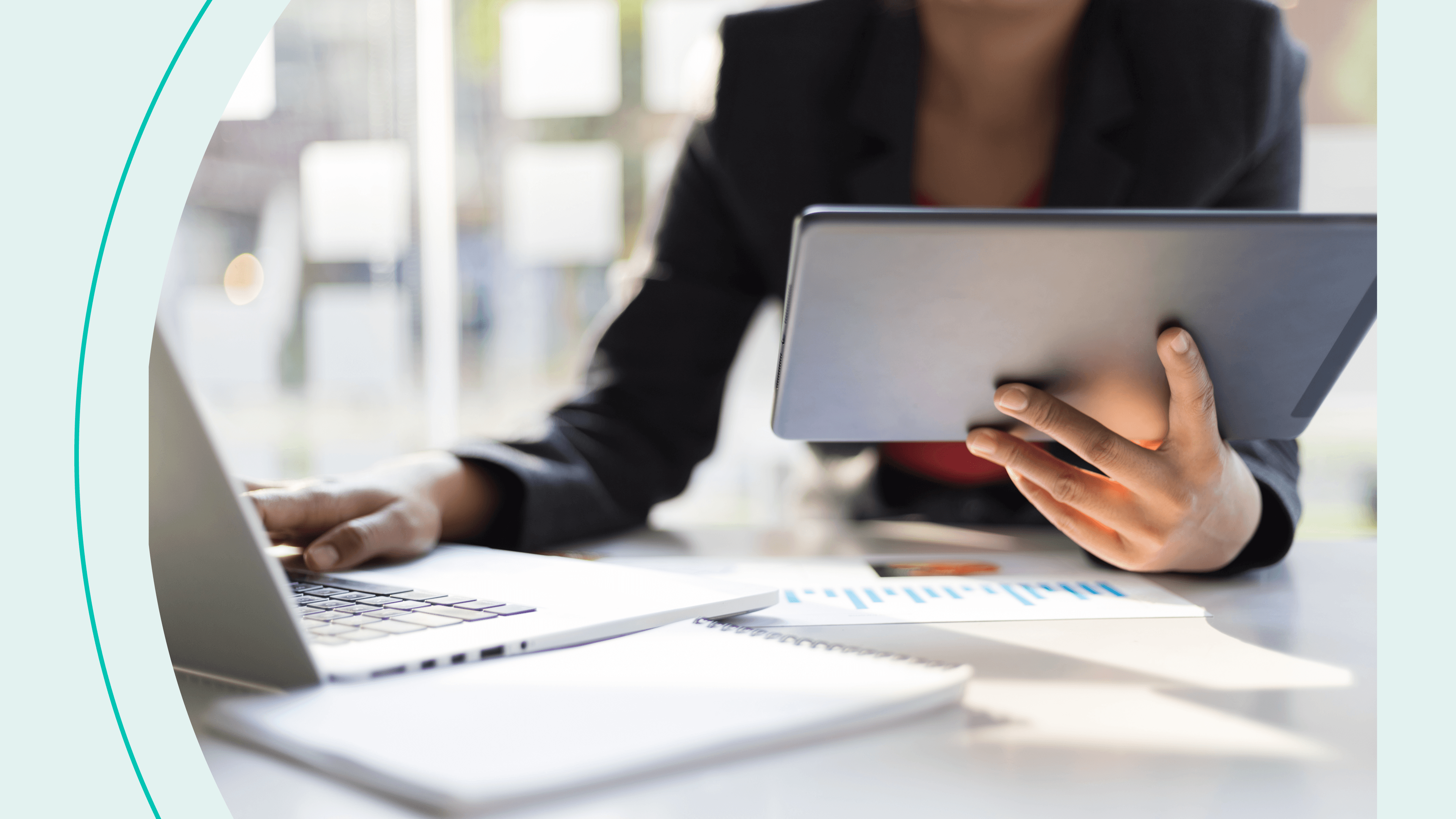 Woman works on tablet and laptop simultaneously