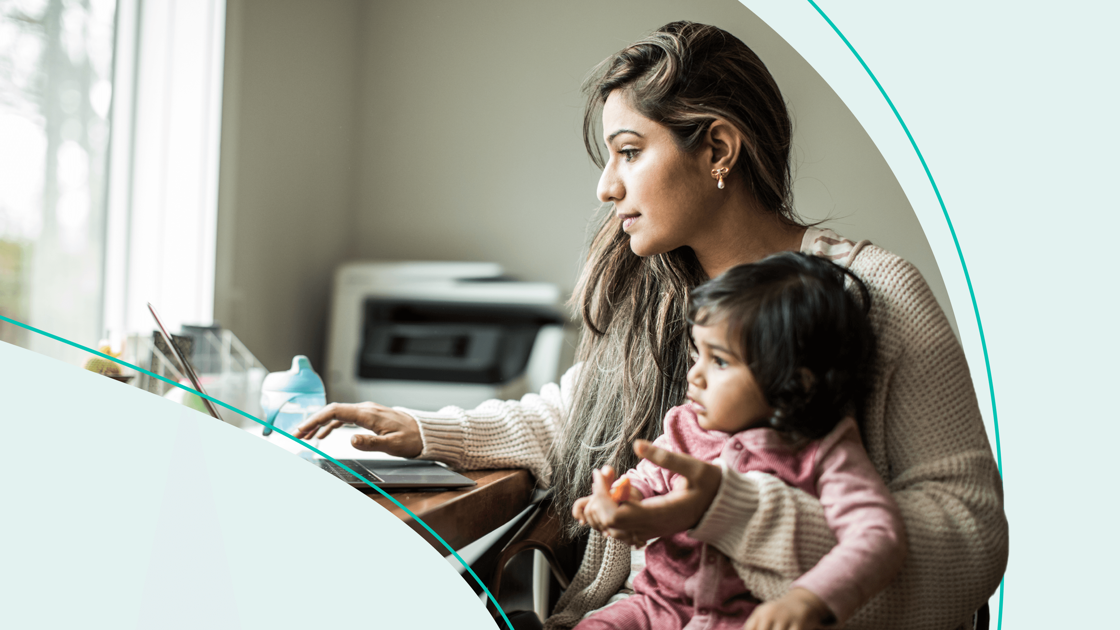mother working with child in lap