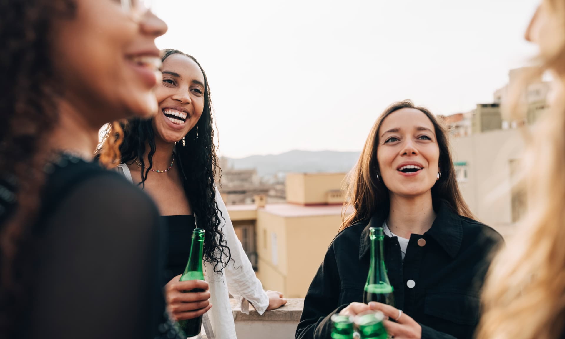Friends talking at a rooftop gathering