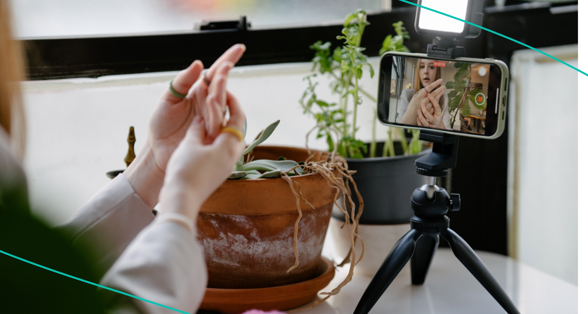 a girl talking into a phone on a tripod