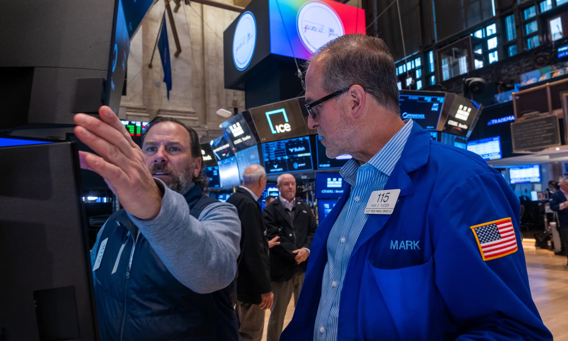Traders work on the floor of the New York Stock Exchange (NYSE) on November 07, 2025