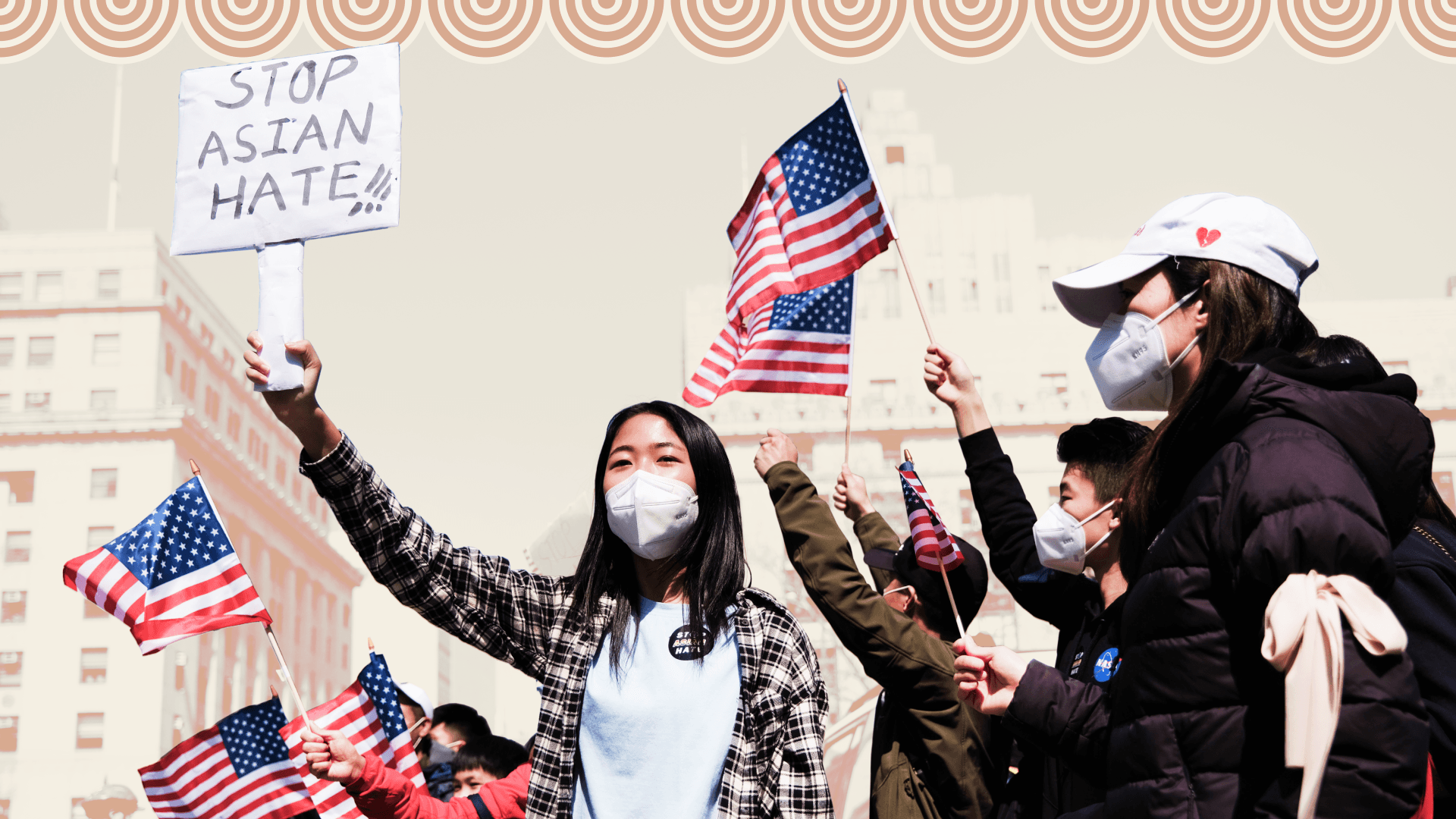 A woman holds a "Stop Asian Hate" sign as others at an NYC rally