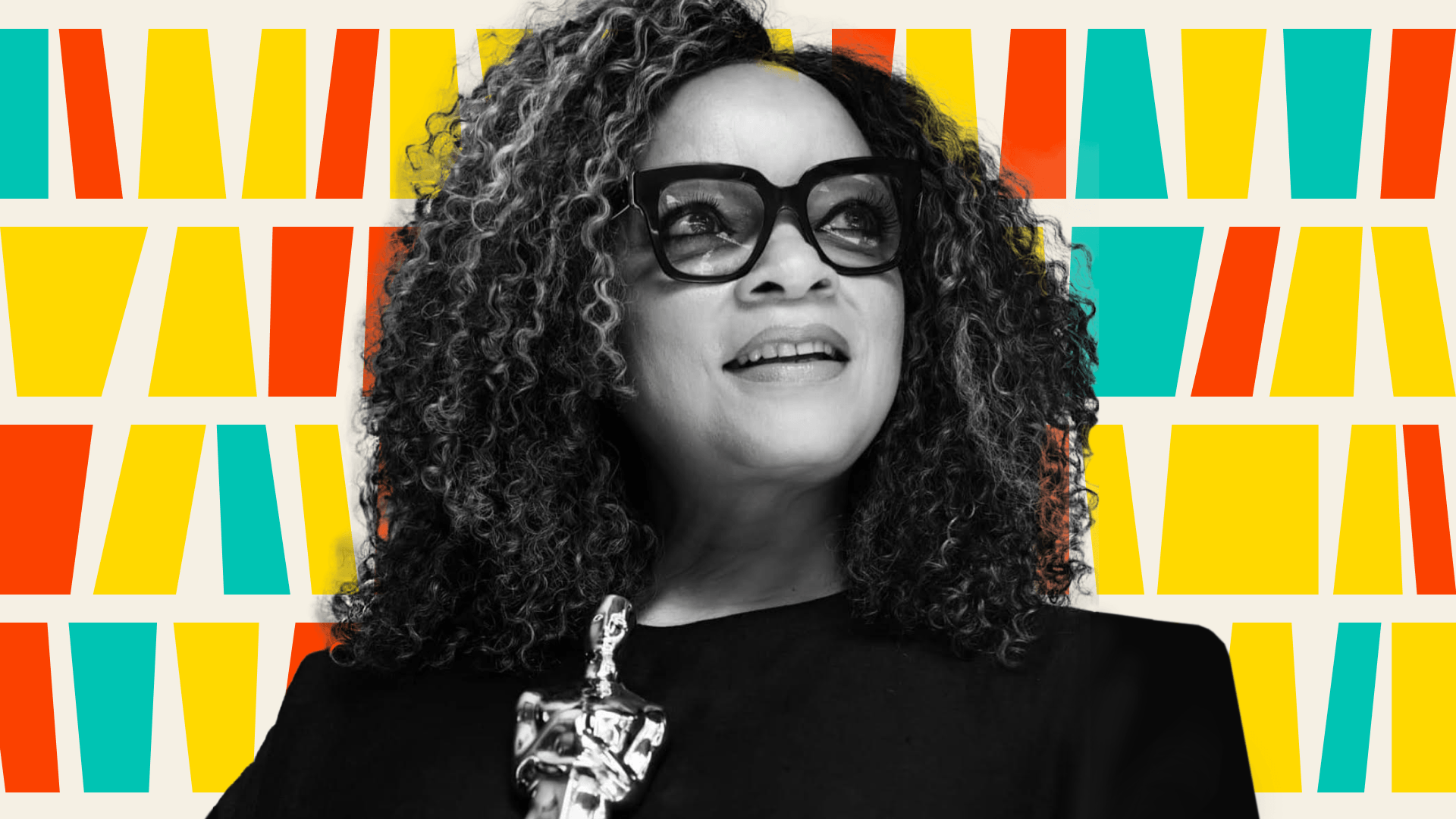 Ruth Carter holding Oscar.