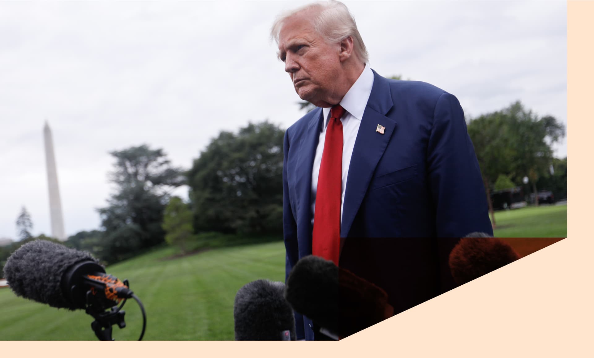 Trump speaking to reporters in front of the Washington Monument