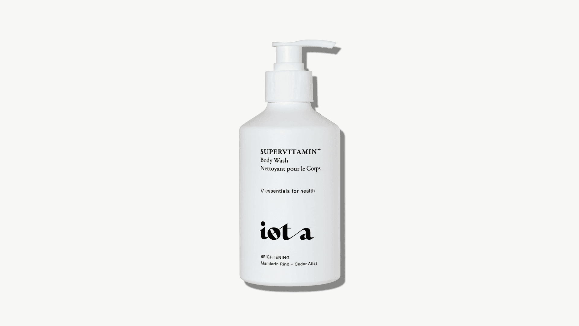 Bottle of white body wash on light gray background
