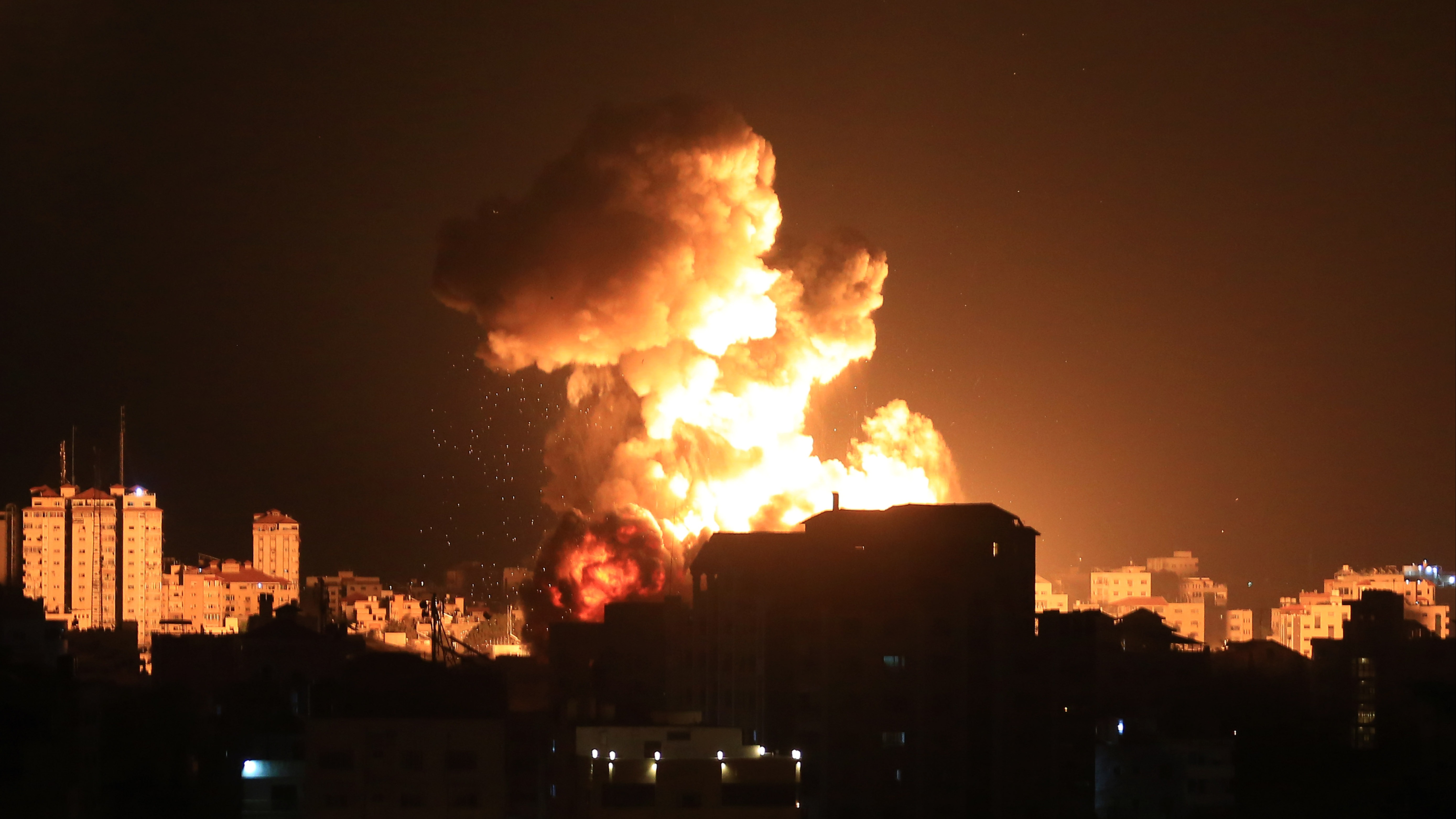 Smoke and flames rise after Israeli fighter jets conducted airstrikes in Gaza City, Gaza on May 13, 2021.
