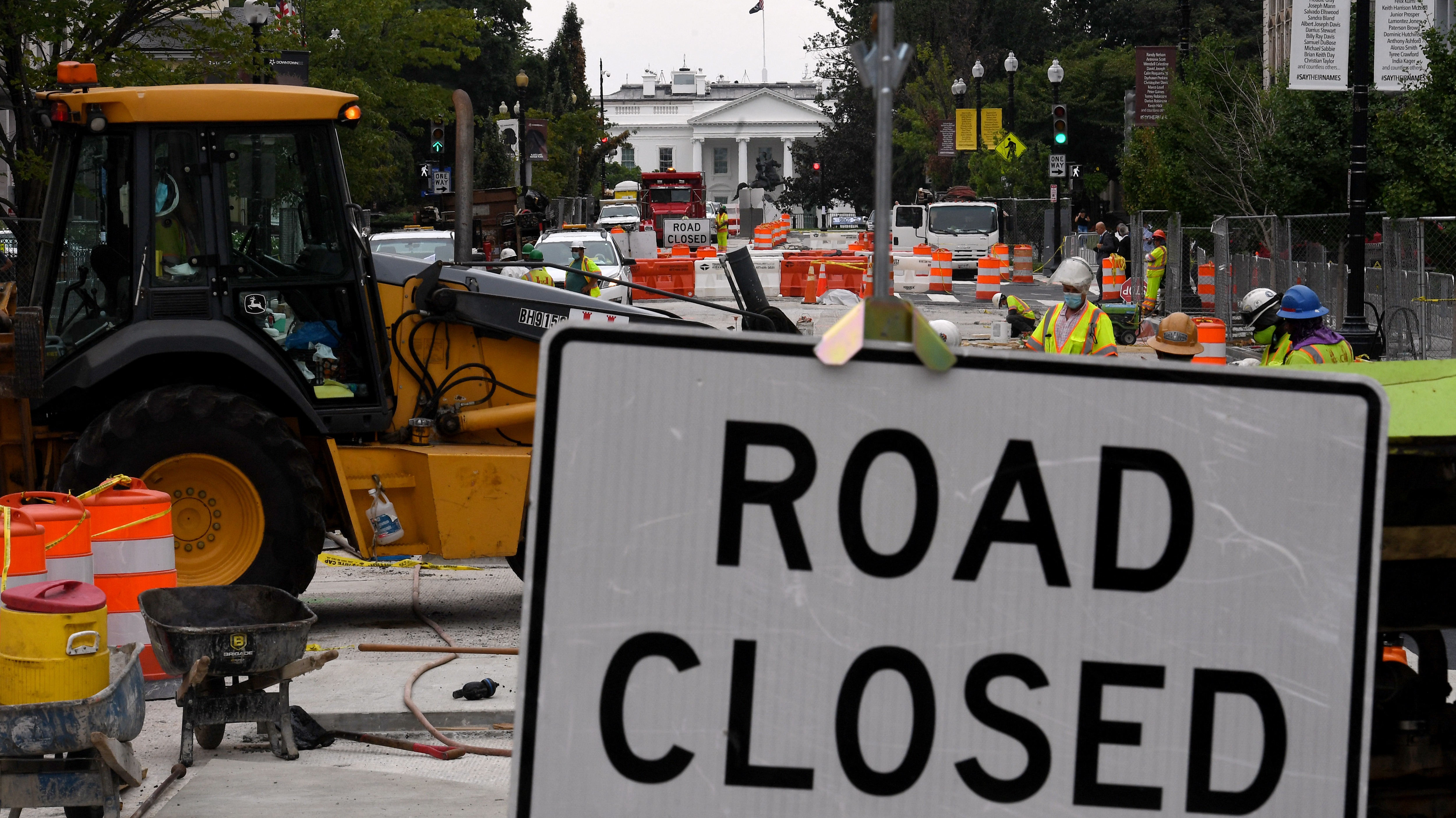 Construction workers repair a street near the White House