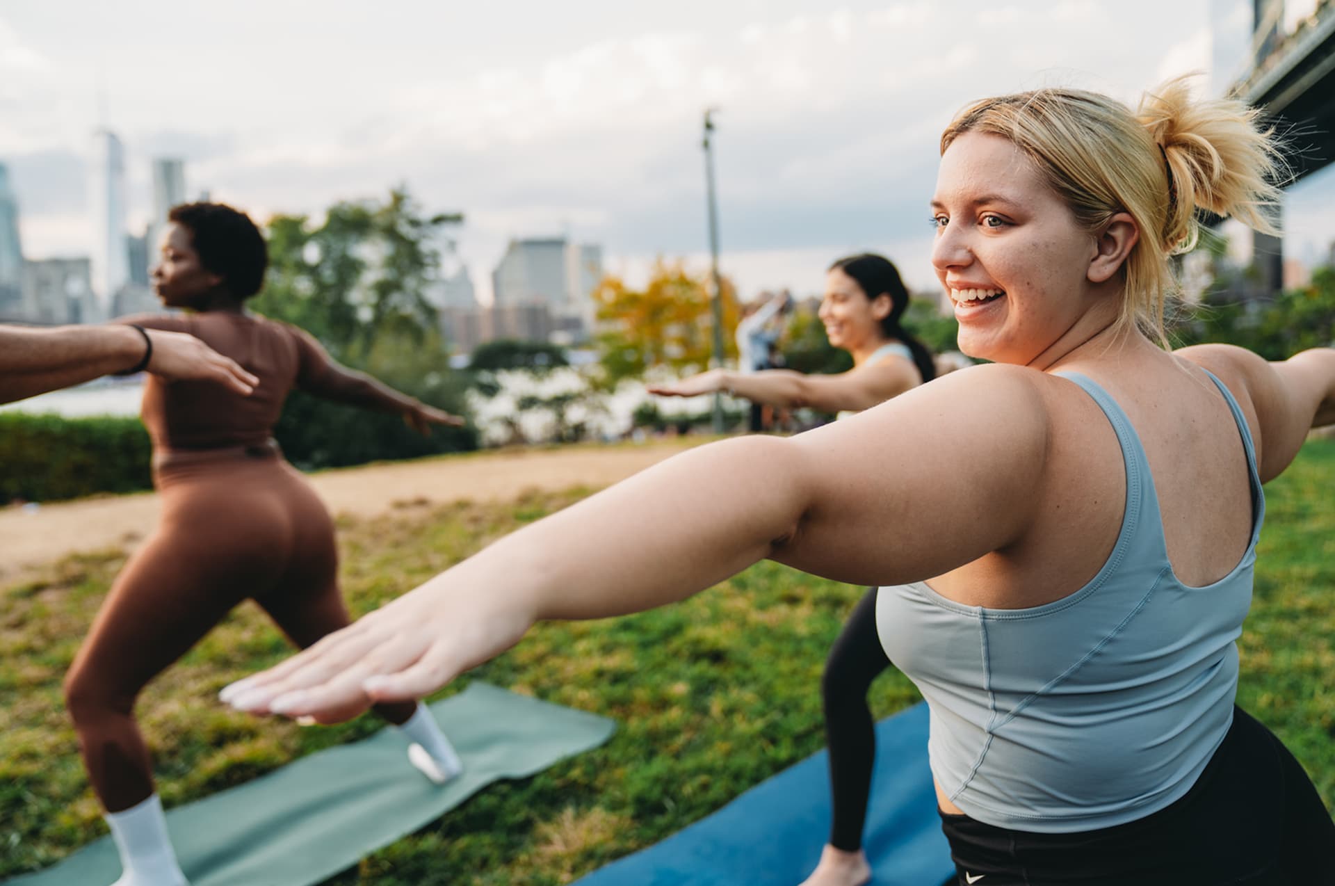 Woman doing yoga as part of a daily routine to put her health first.