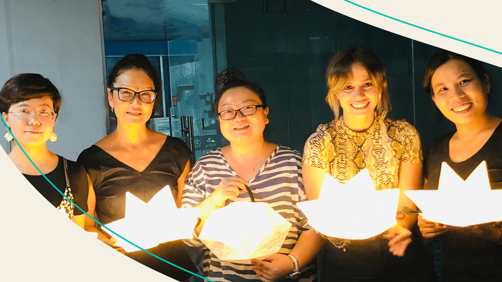 Alice Chun second from left holding her invention the SolarPuff alongside other women who helped create them