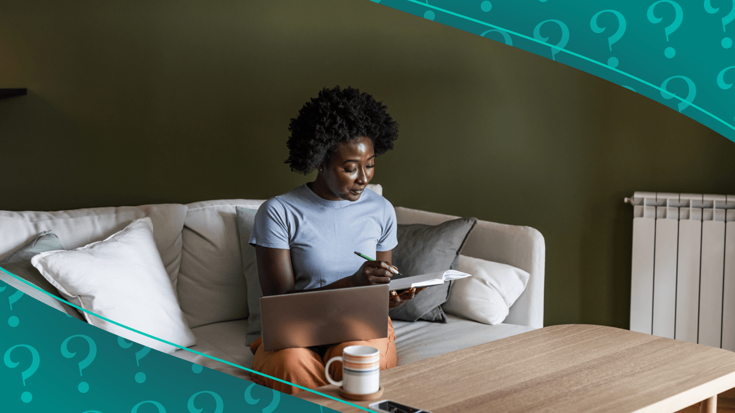 Woman sitting on sofa and working
