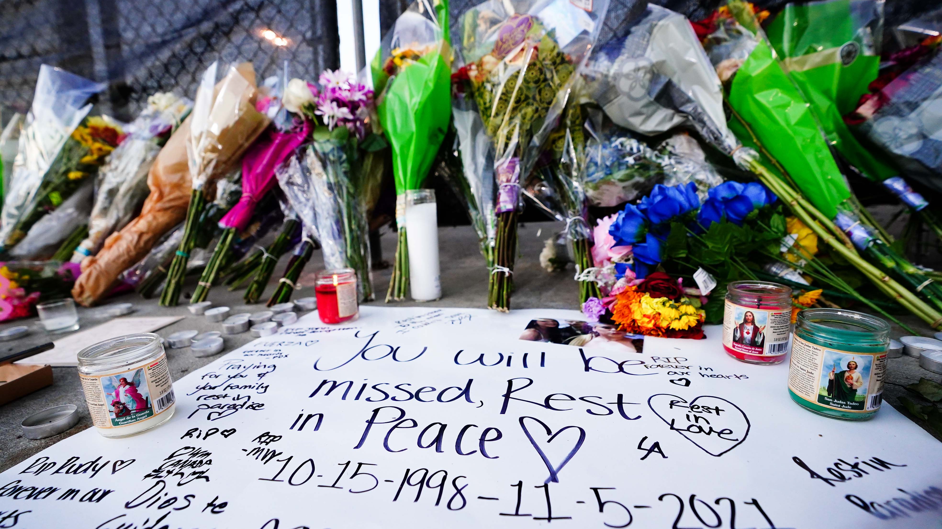 Candles, flowers and letters are placed at a memorial outside of the canceled Astroworld festival at NRG Park on November 7, 2021 in Houston, Texas.