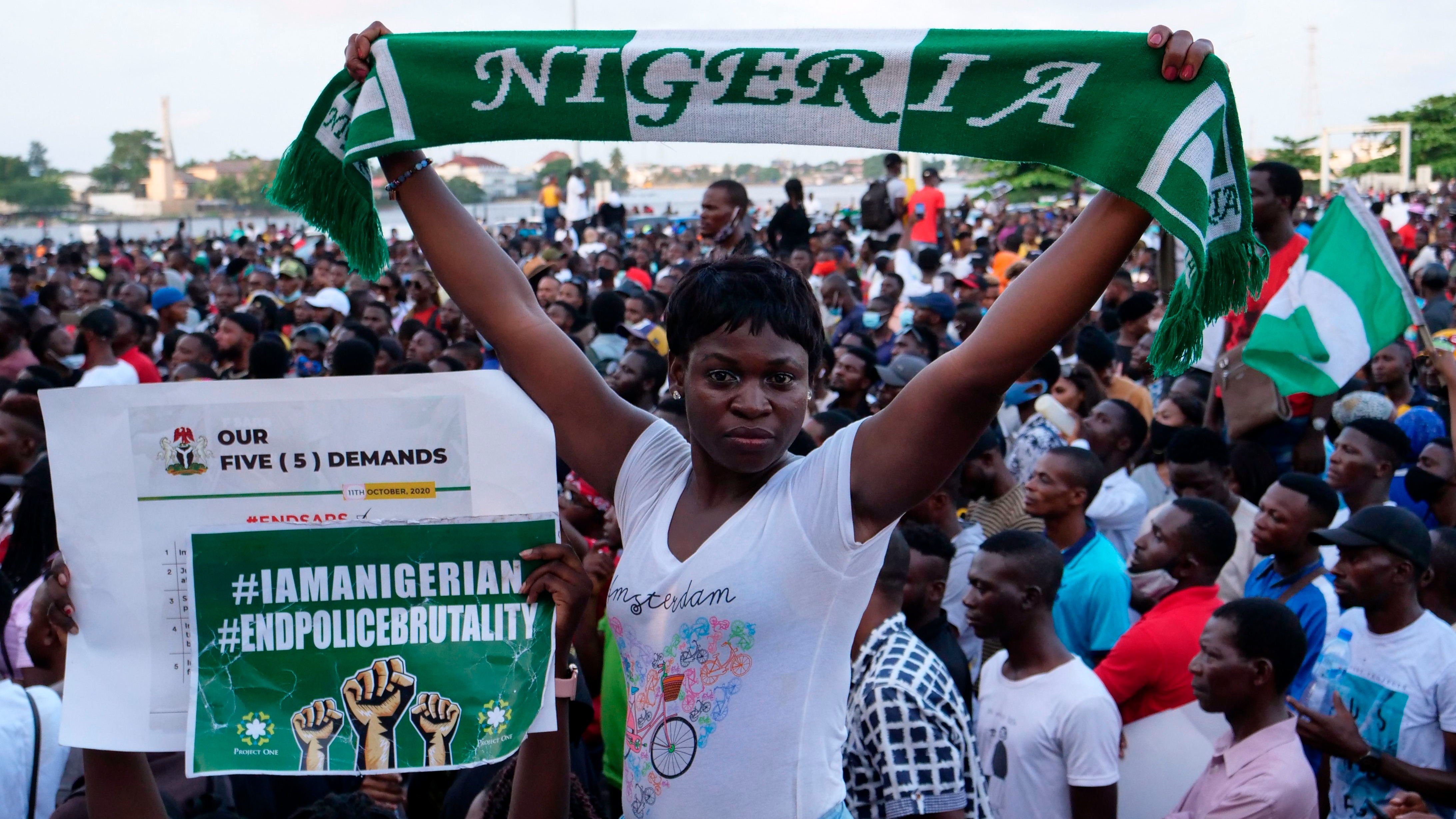 A protester at a live concert at the Lekki toll gate in Lagos, on October 15, 2020, during a demonstration to protest against police brutality and scrapping of Special Anti-Robbery Squad (SARS)