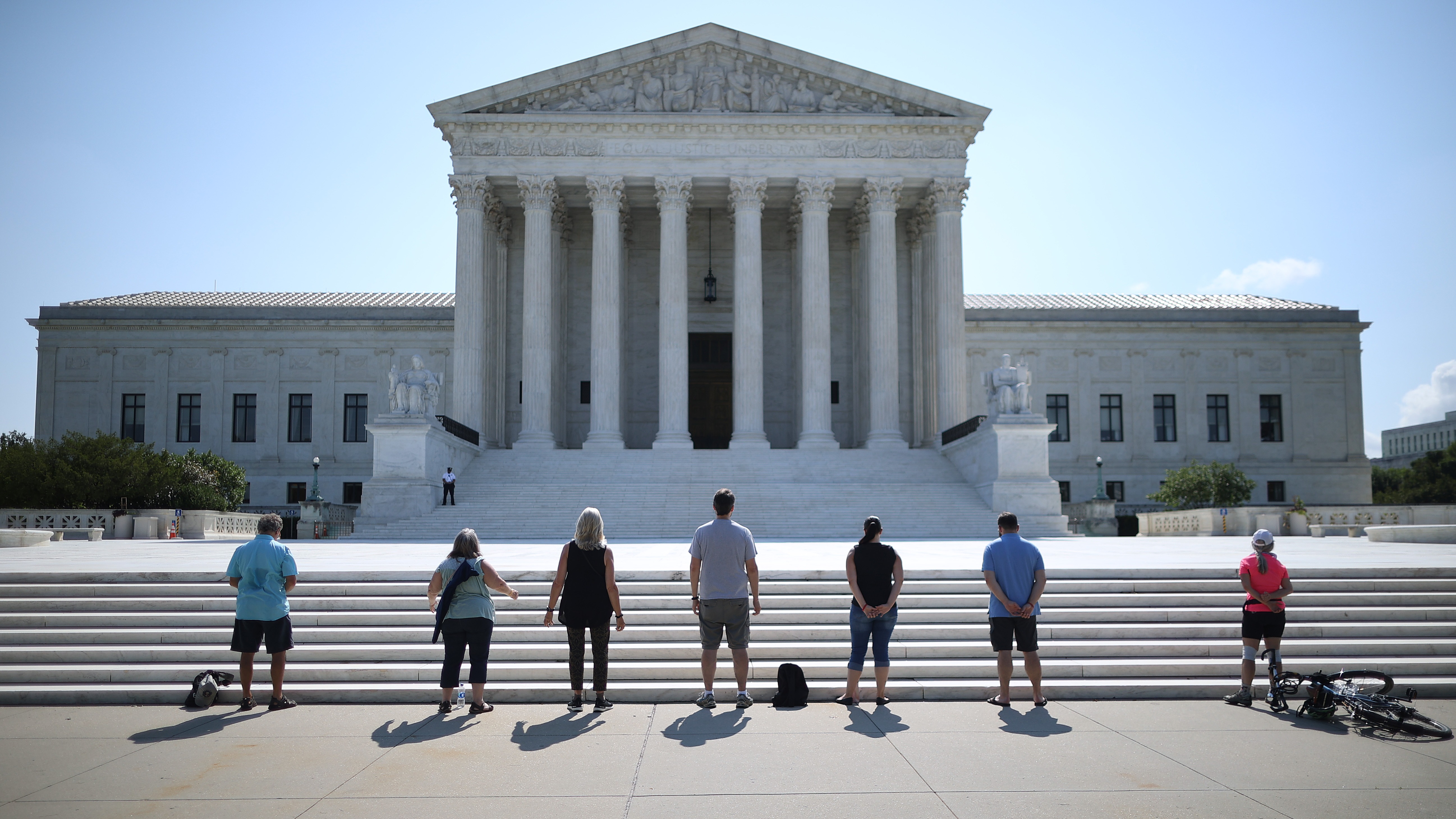 Anti-abortion demonstrators pray in front of the U.S. Supreme Court on July 08, 2020.