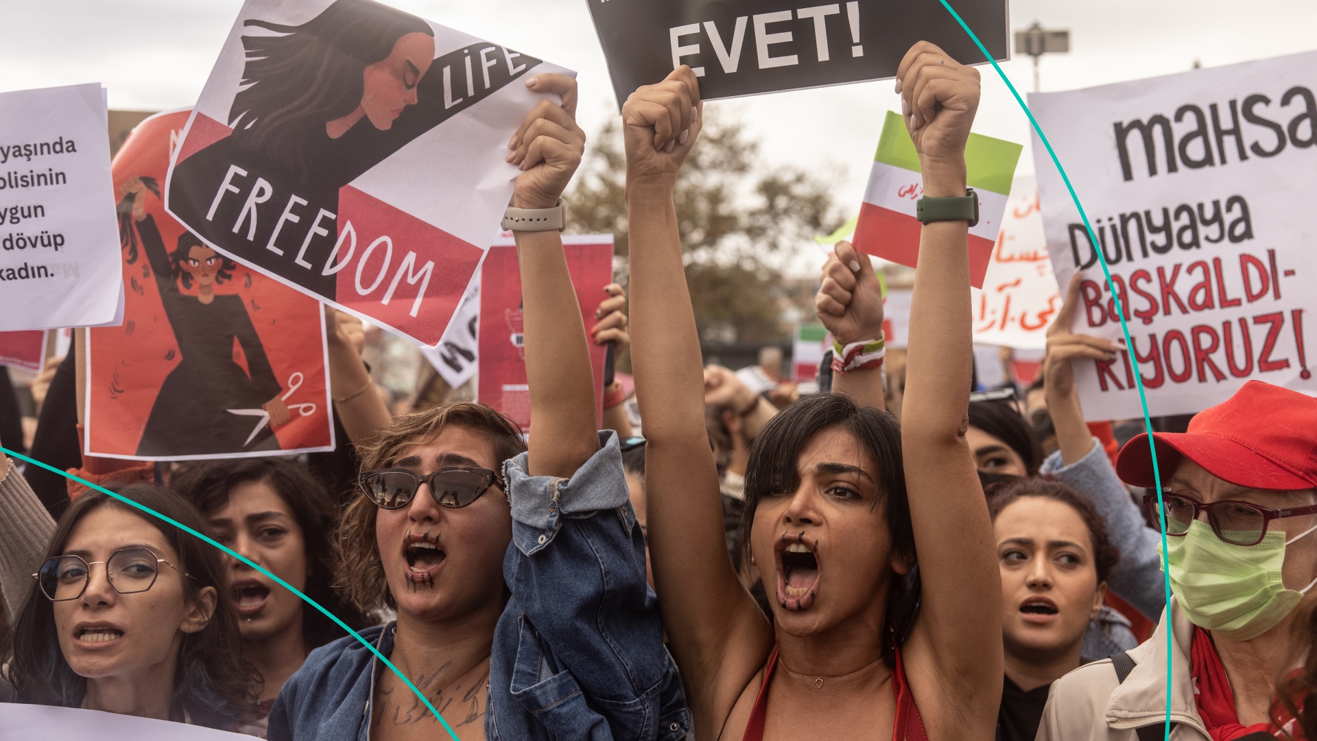 People hold signs and chant slogans during a protest against the death of Iranian Mahsa Amini and the government of Iran on October 02, 2022 in Istanbul, Turkey