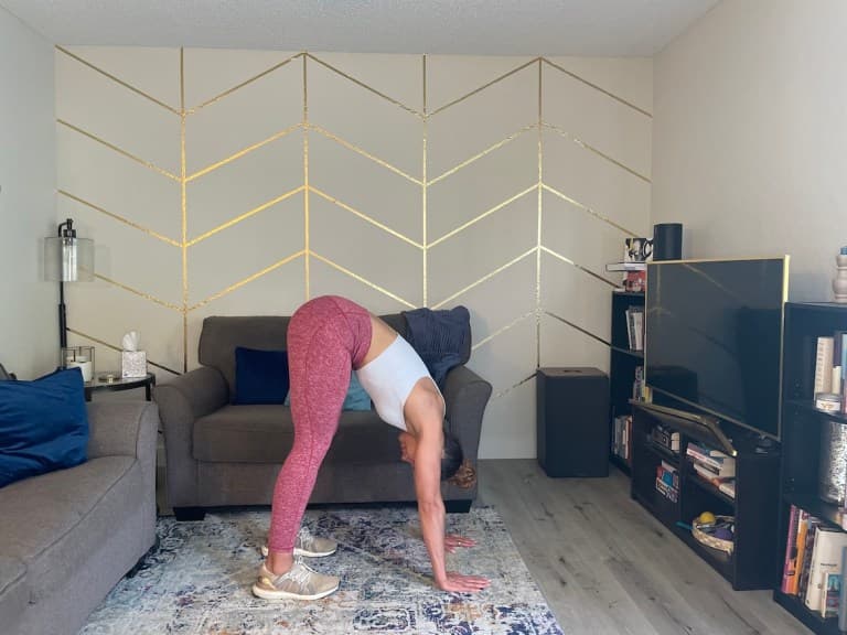 Personal trainer demonstrating short dog exercise