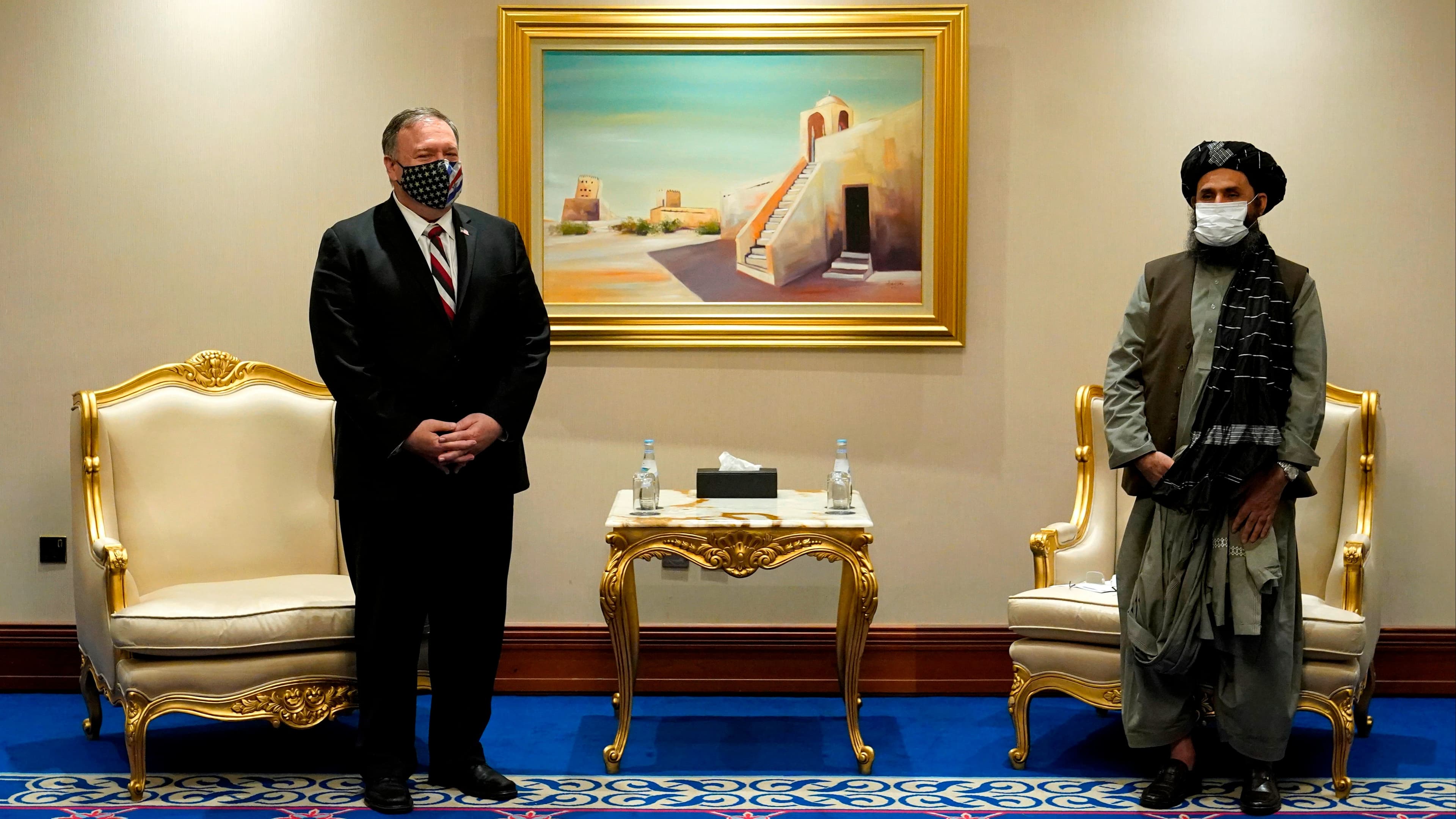 US Secretary of State Mike Pompeo (L) meets with Taliban co-founder Mullah Abdul Ghani Baradar in the Qatari capital Doha on November 21, 2020, amid signs of progress in their talks as Washington speeds up its withdrawal.