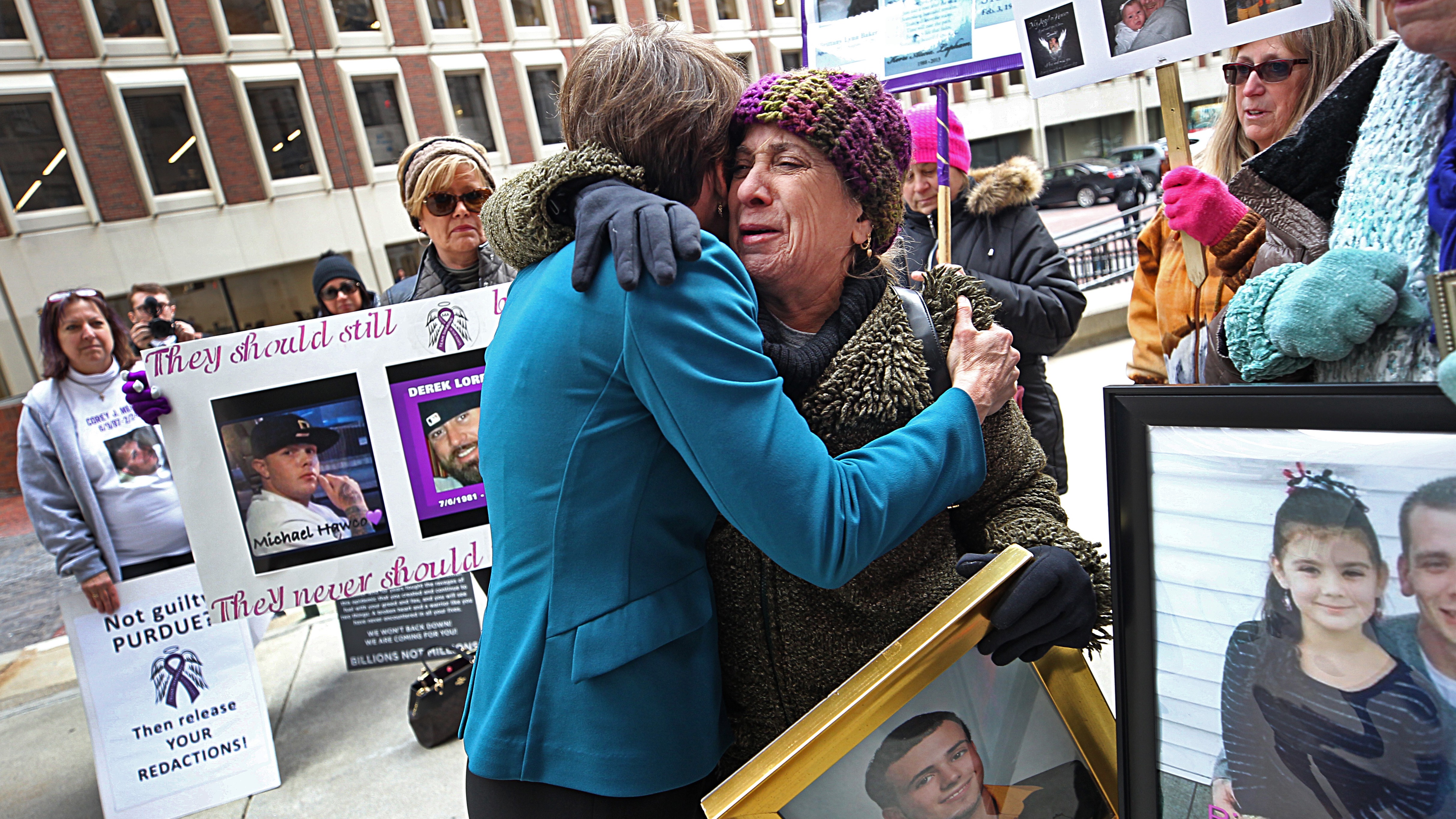 Protesters against opioids, hugging