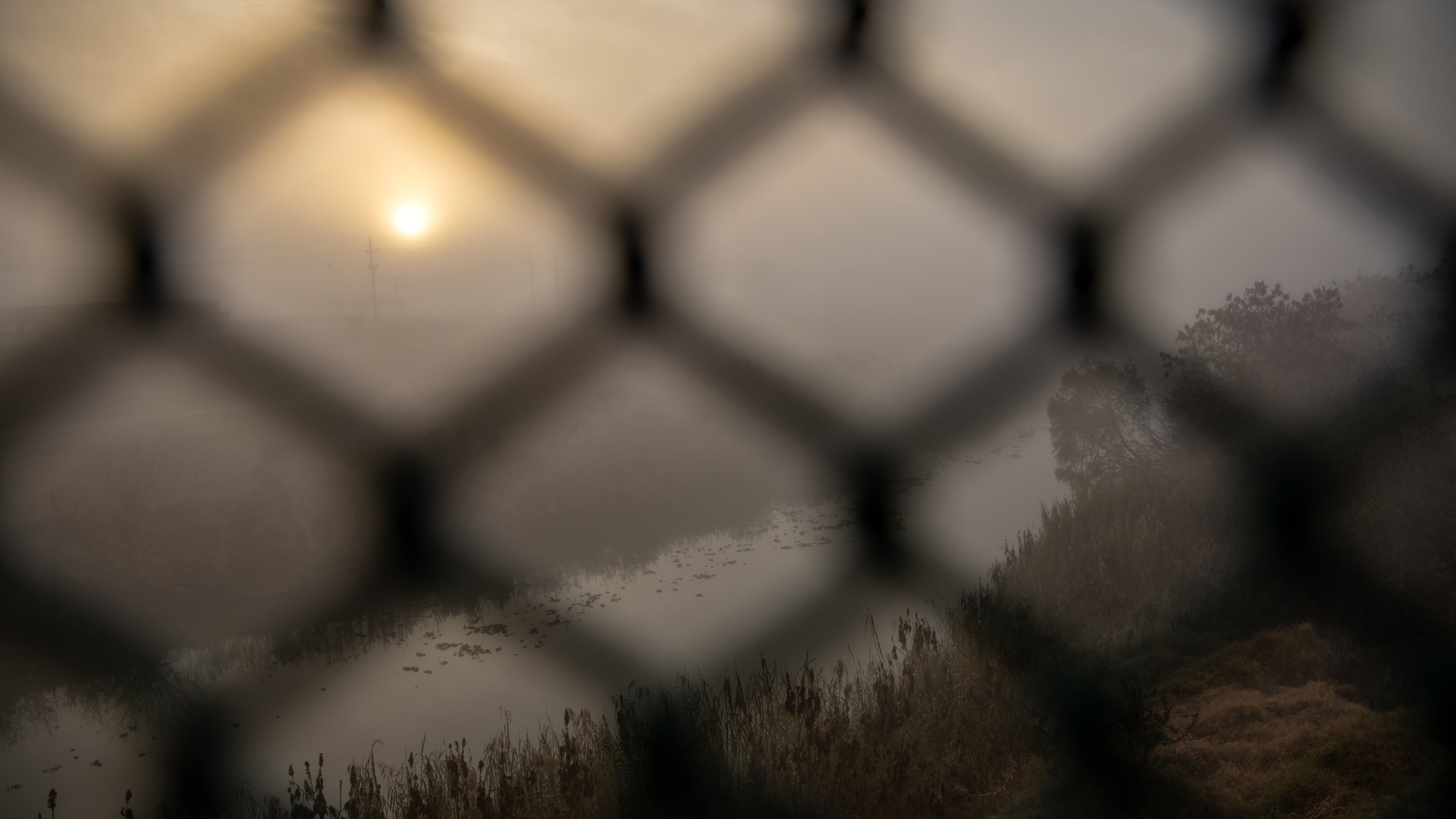The Rio Grande flows under a sunrise fog at the U.S.-Mexico border on February 23, 2021 in Matamoros, Mexico.