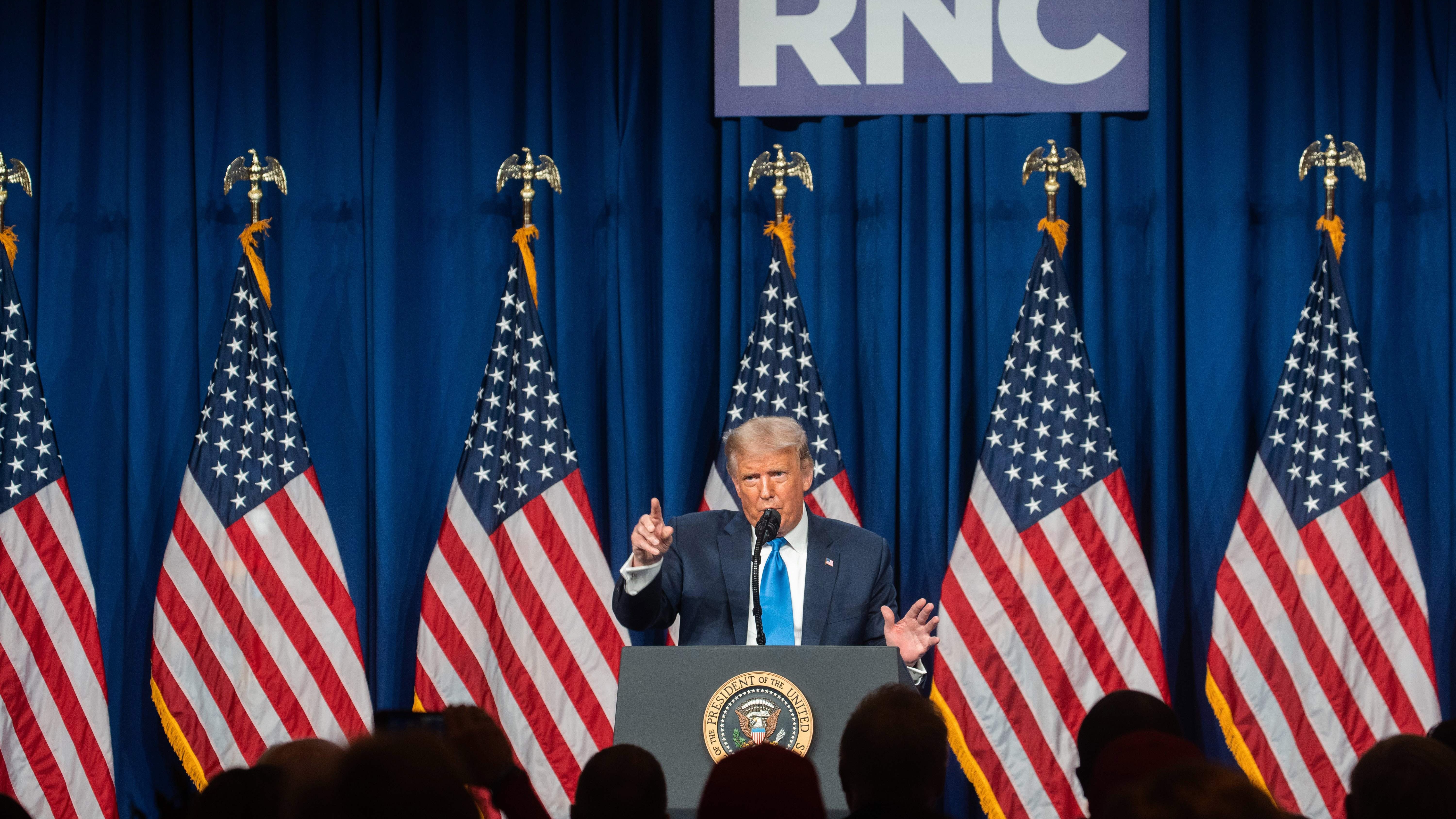 President Donald Trump speaks as delegates gather during the first day of the Republican National Convention