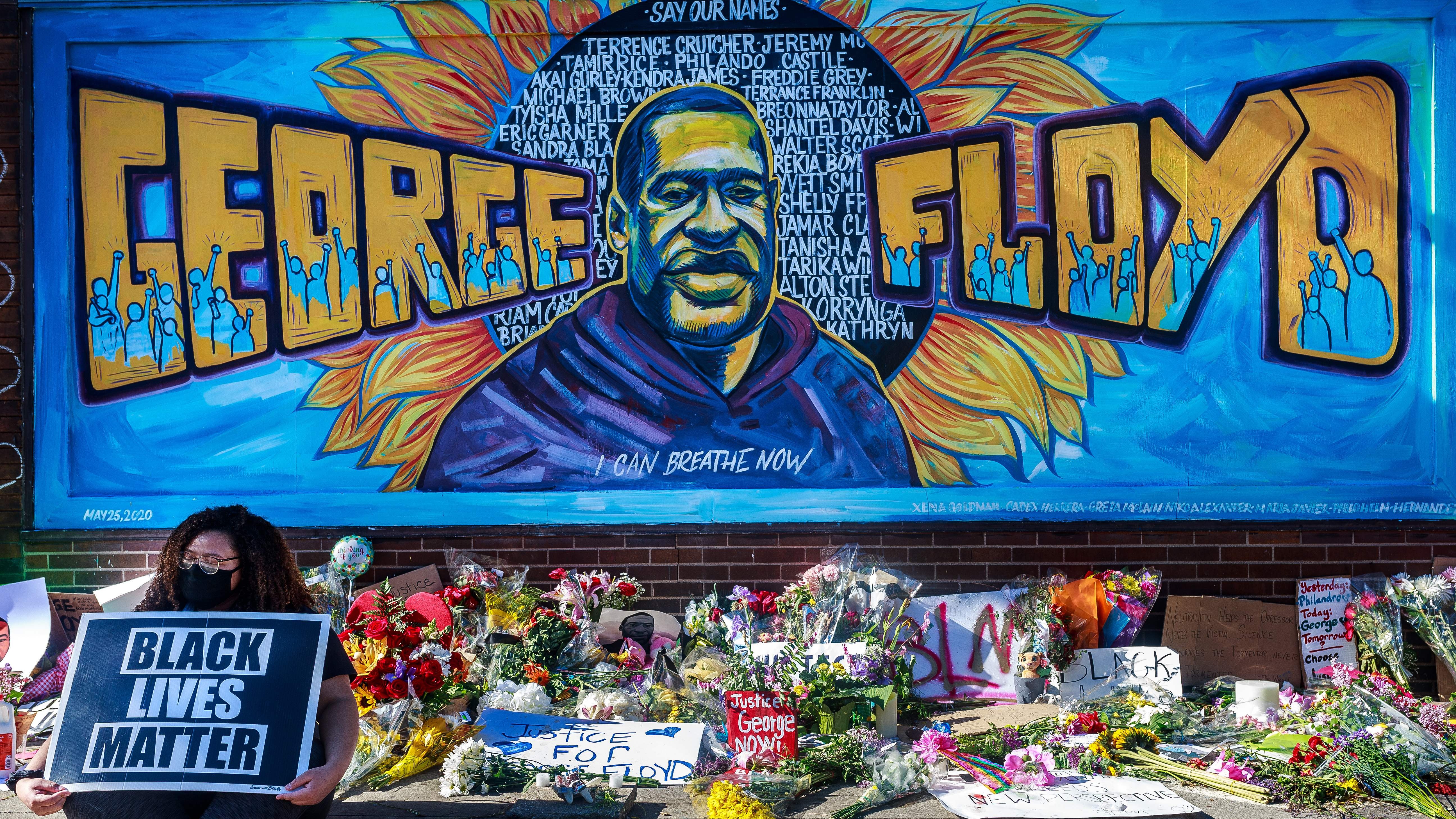 Flowers, signs and balloons are left near a makeshift memorial to George Floyd near the spot where he died while in custody of the Minneapolis police, on May 29, 2020 in Minneapolis, Minnesota.