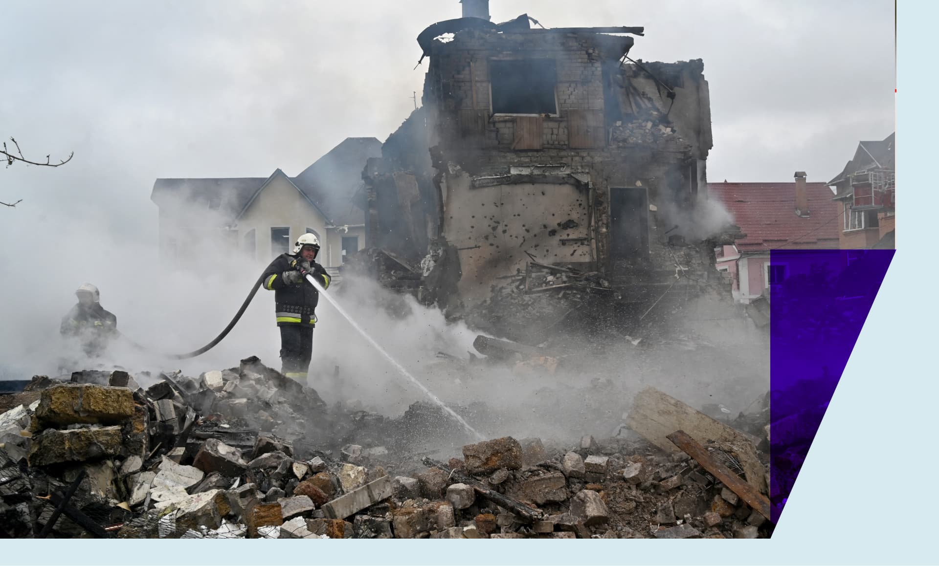Firefighters extinguish a blaze in damaged private houses following Russian strike in Kyiv region on May 25, 2025