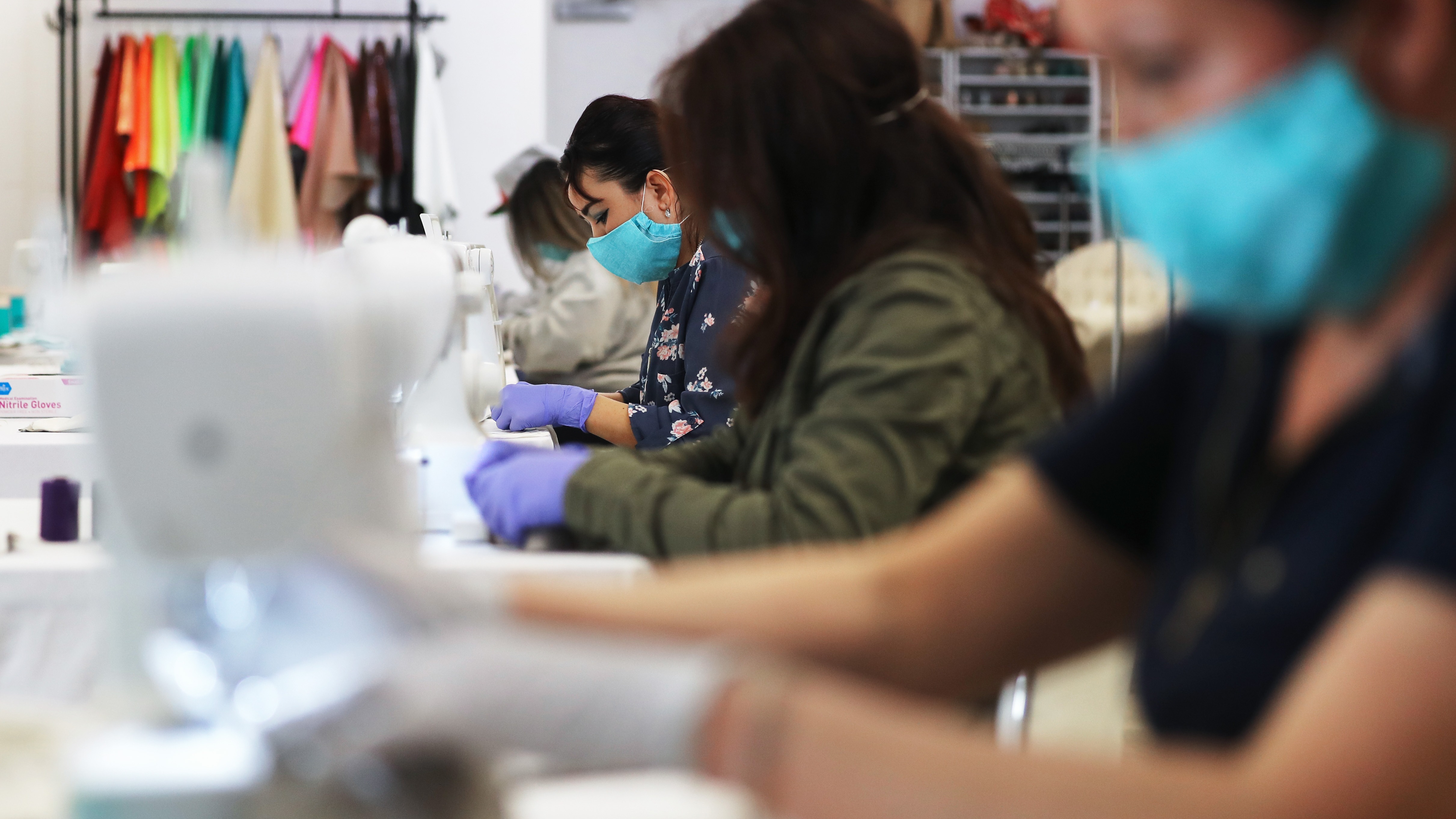 People assembling masks
