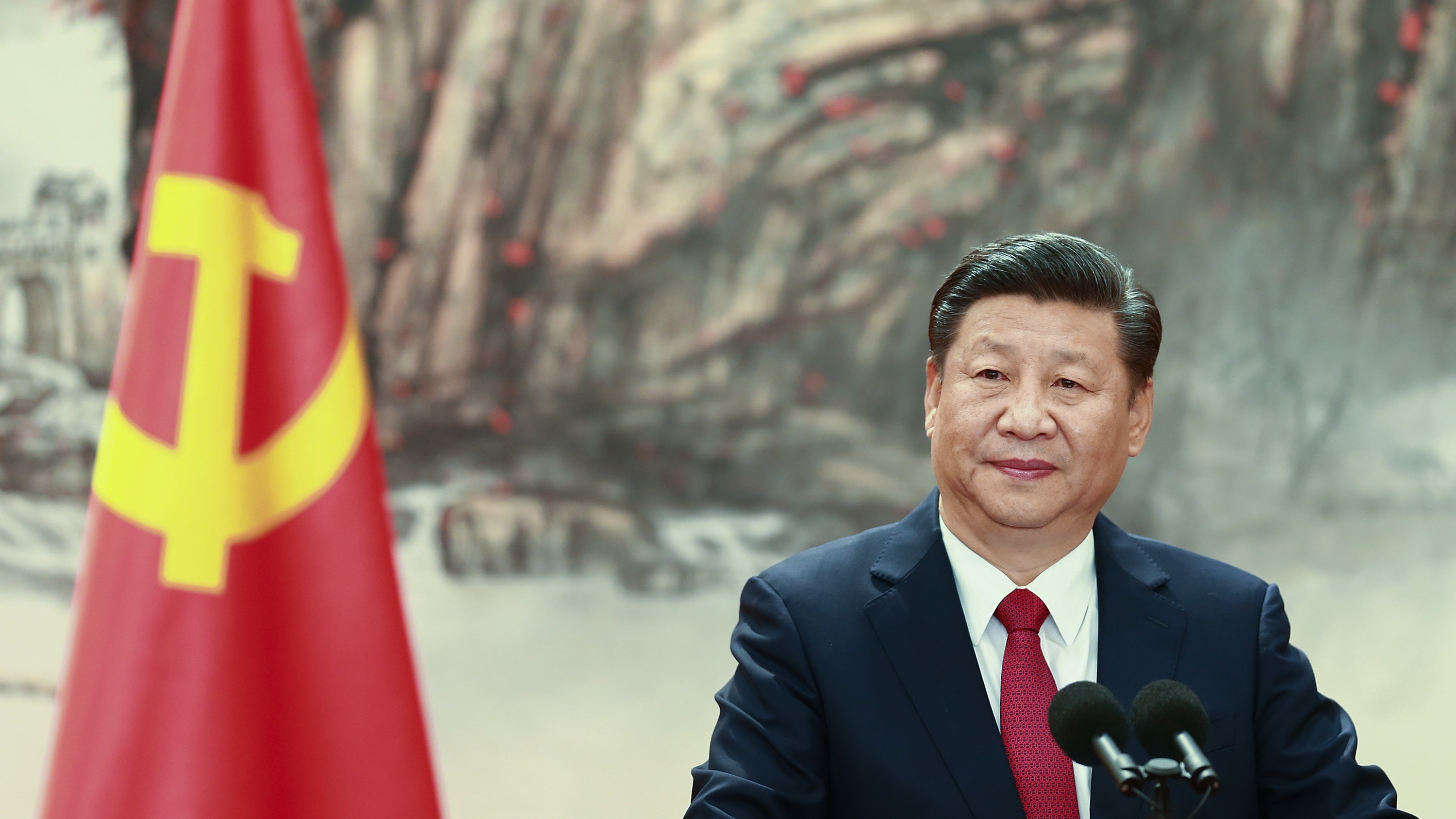Chinese President Xi Jinping speaking at a podium
