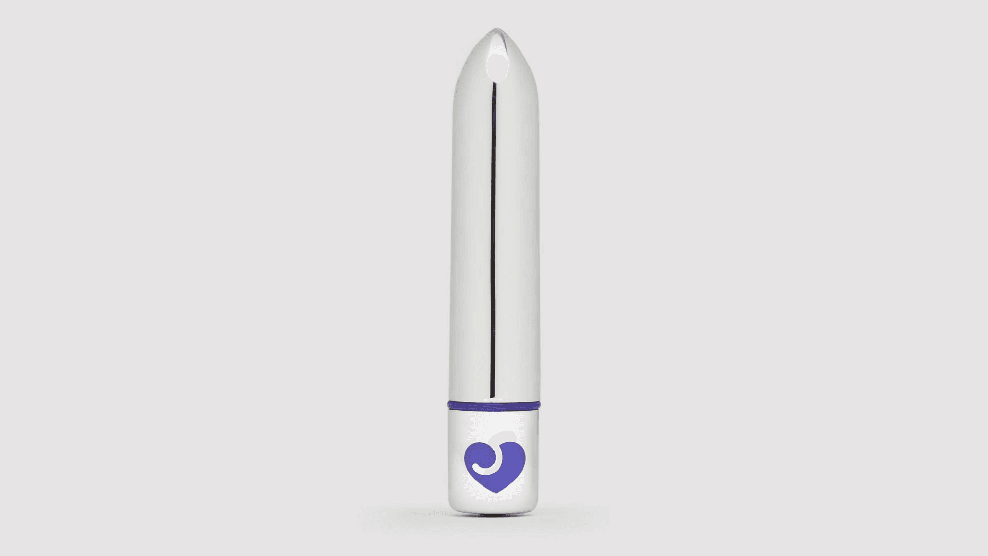 Silver bullet shaped vibrator with purple metallic heart logo on bottom