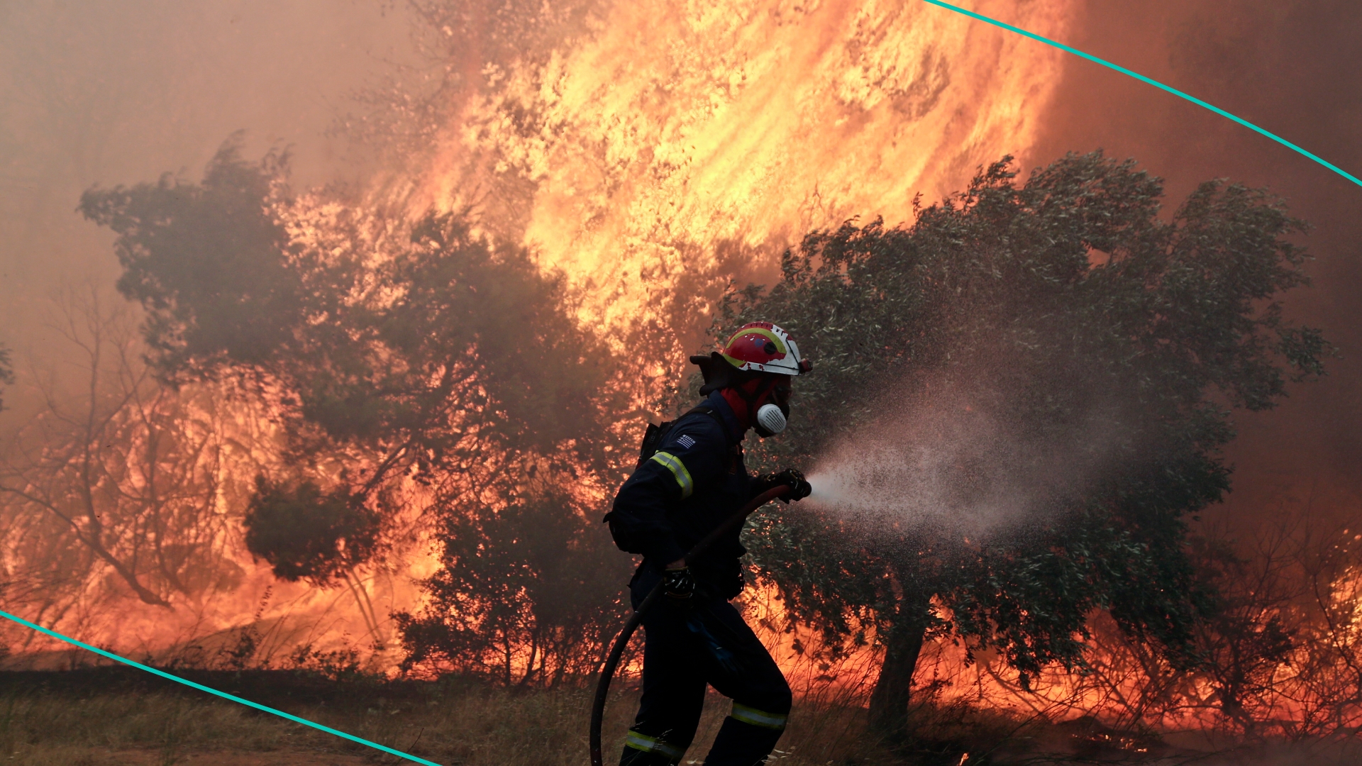 Firefighters confront blazes during a forest fire that broke at the suburb of Pallini, east of Athens, Greece, on Wednesday July 20, 2022.