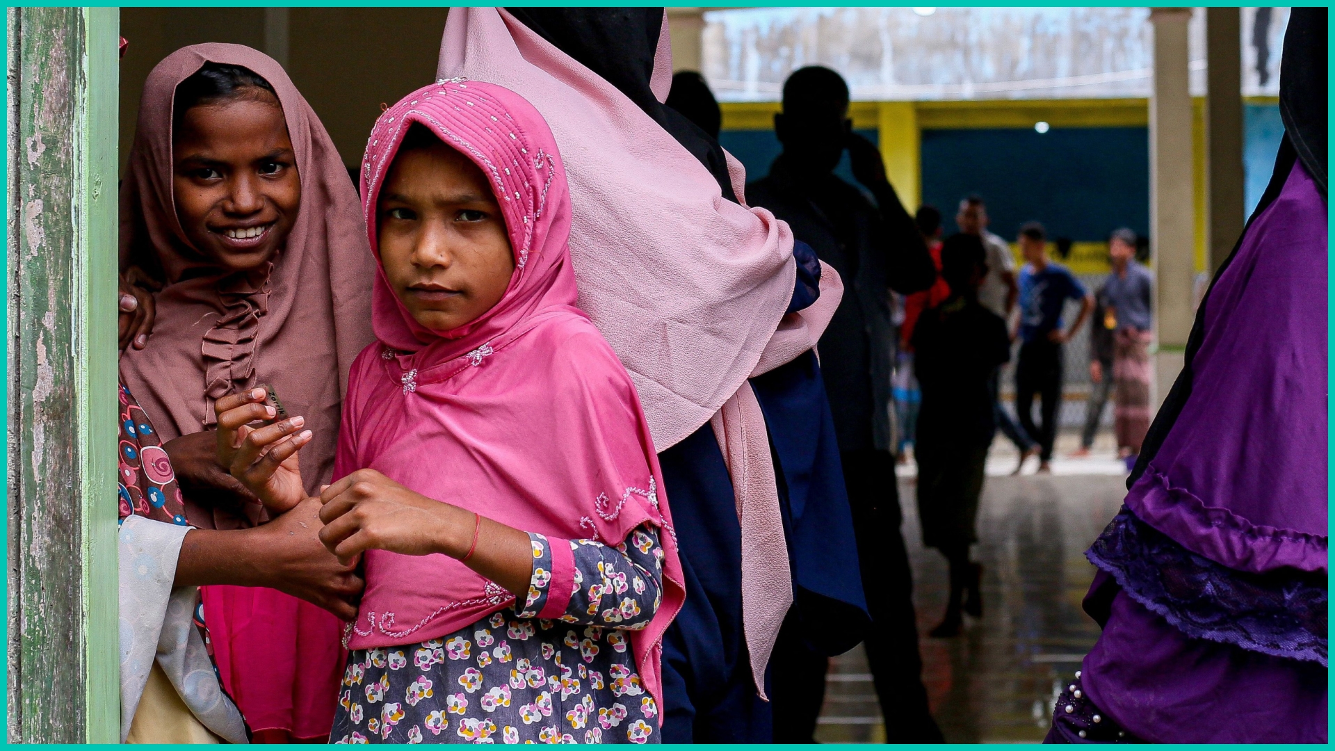 Rohingya refugees look on in the compounds of a mosque following their arrival by boat in Bireuen, Aceh province on March 6, 2022.