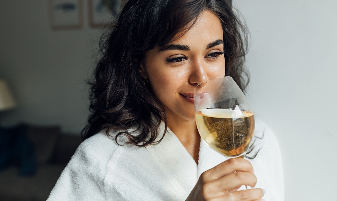 Featured image for Alcohol Can Have Some Surprising Effects on Your Hair—Here's What a Derm and Hairstylist Want You To Know