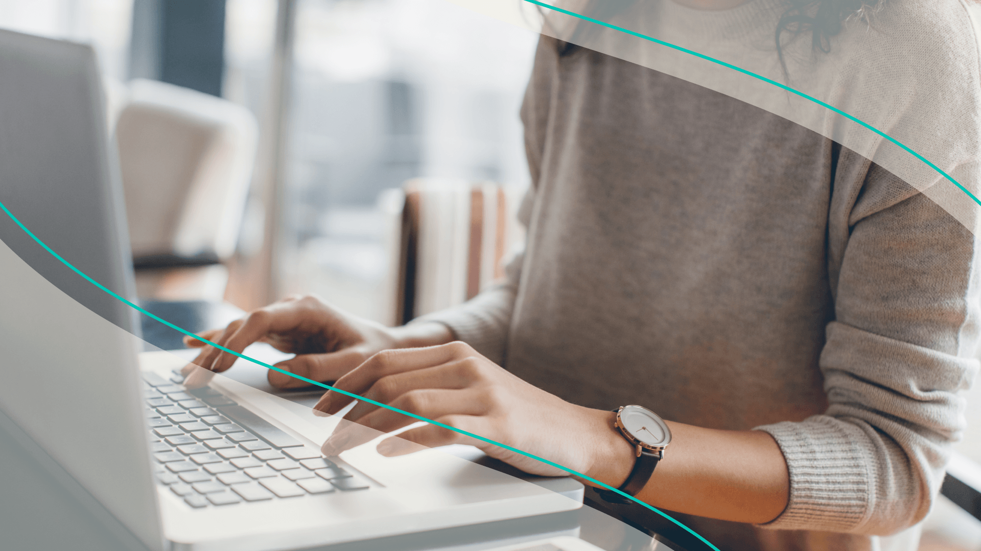 A woman typing on a laptop