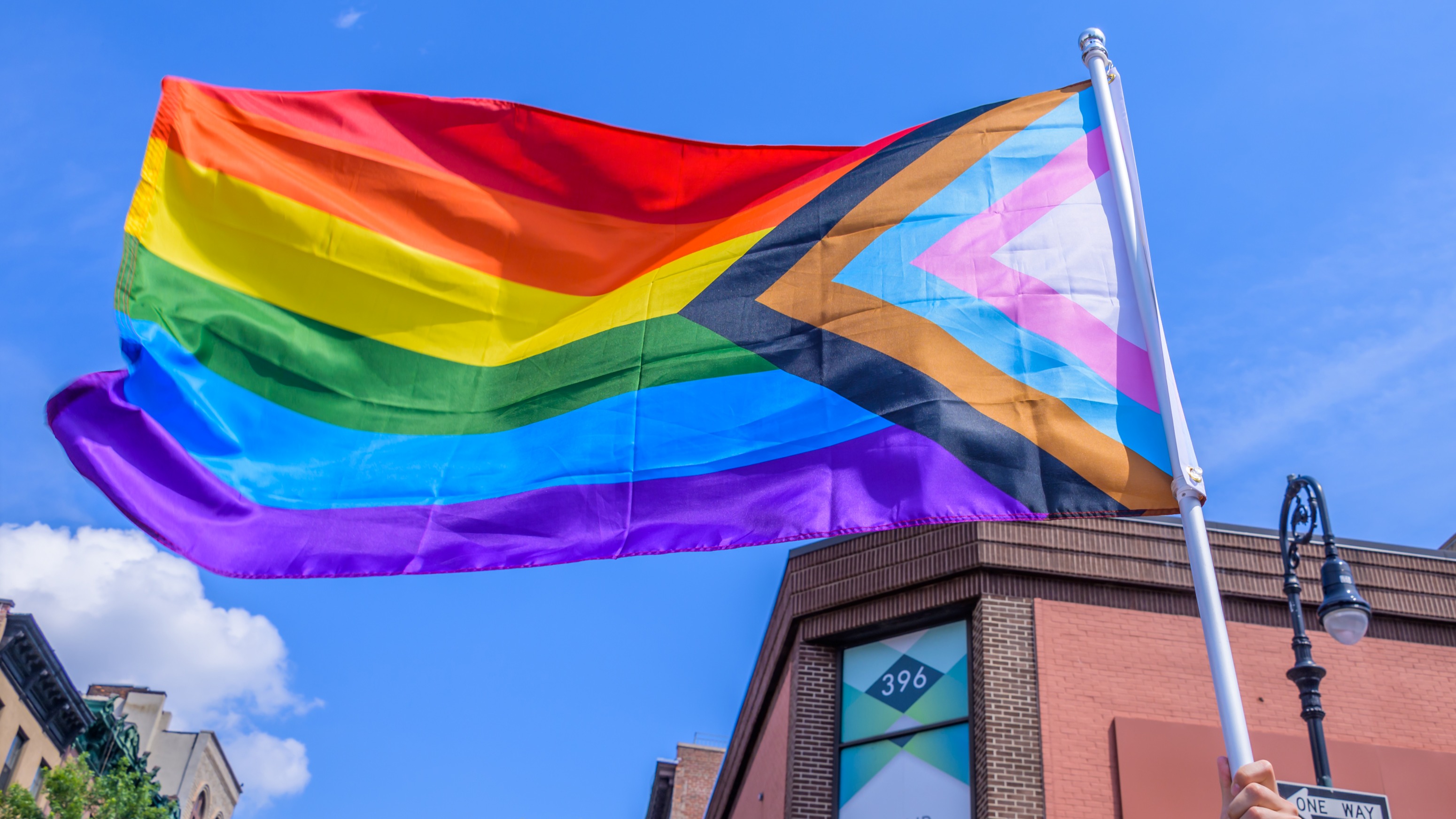Participant holding a rainbow flag.