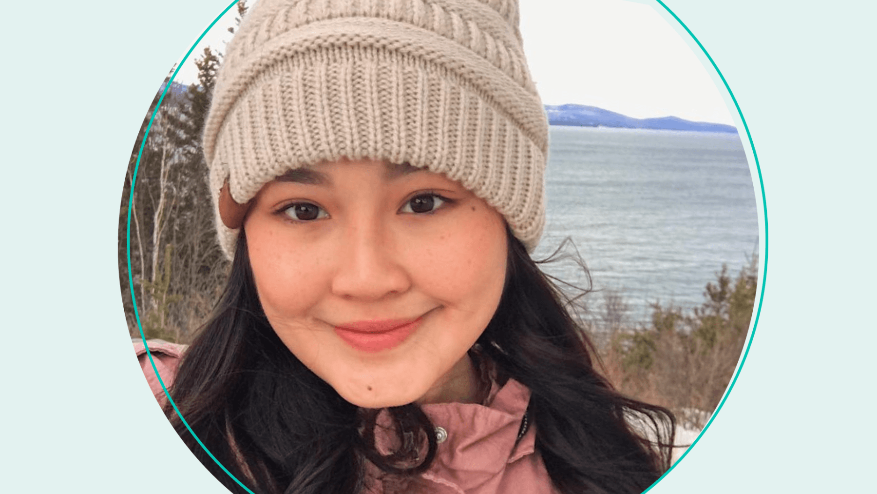 Selfie of Vishaka with teal background