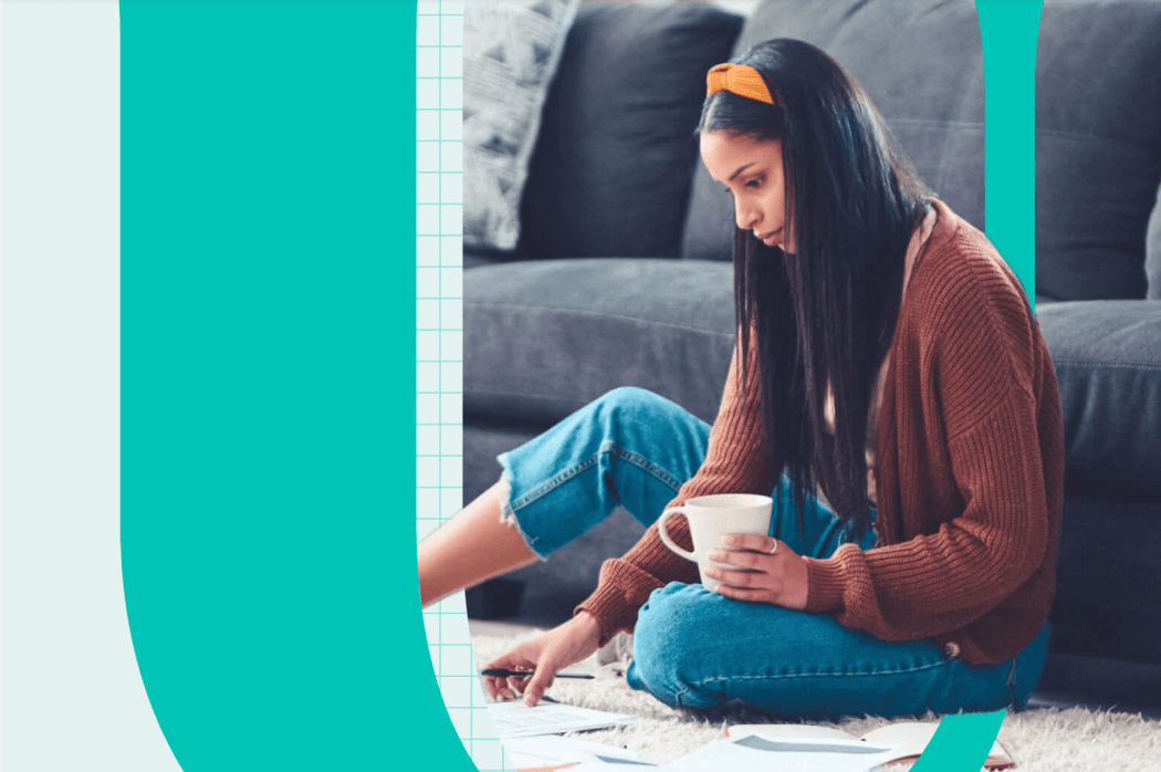 SkimmU Woman with coffee on floor looking at notes