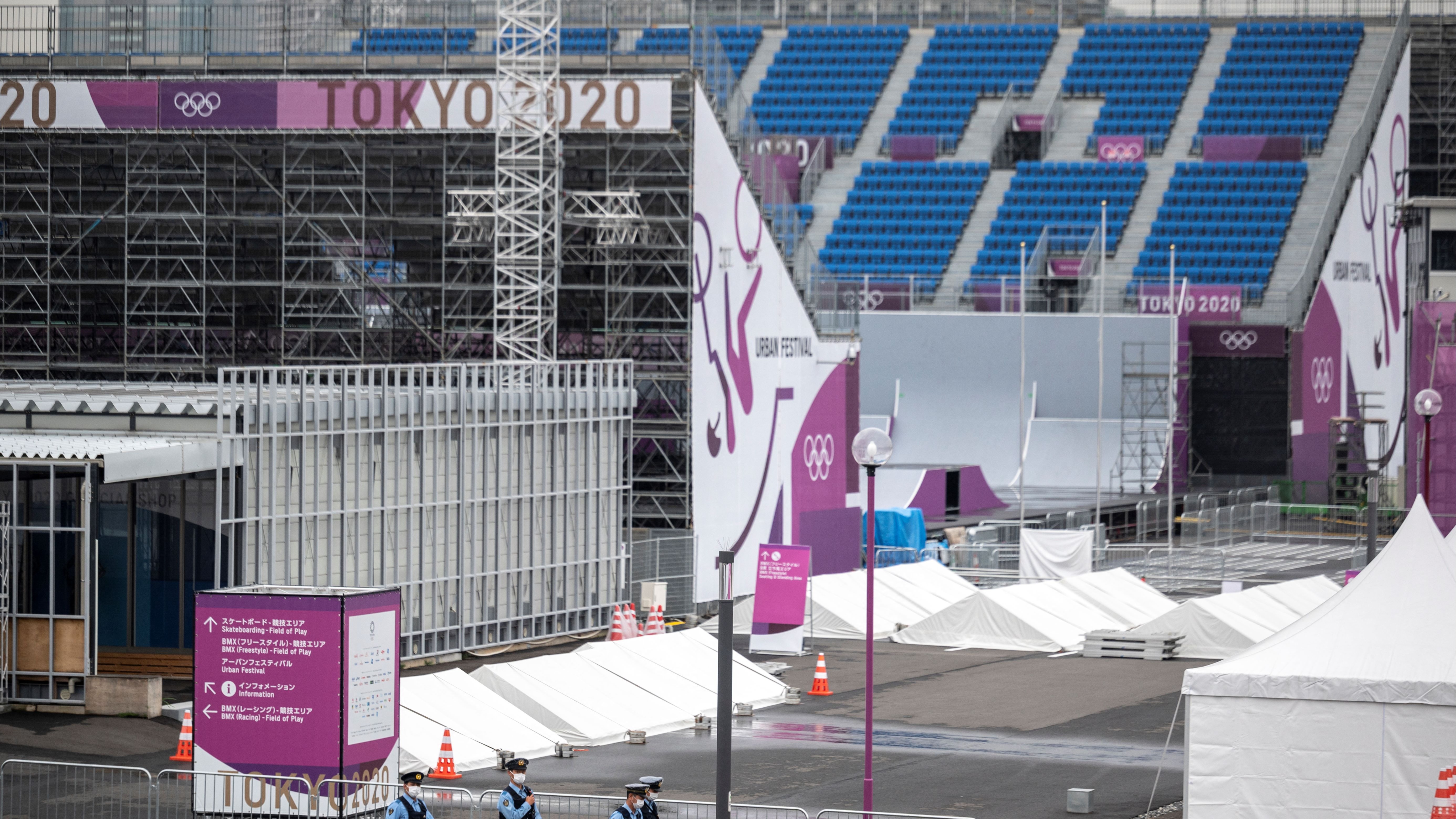 Police patrol the area around the Ariake Urban Sports Park.