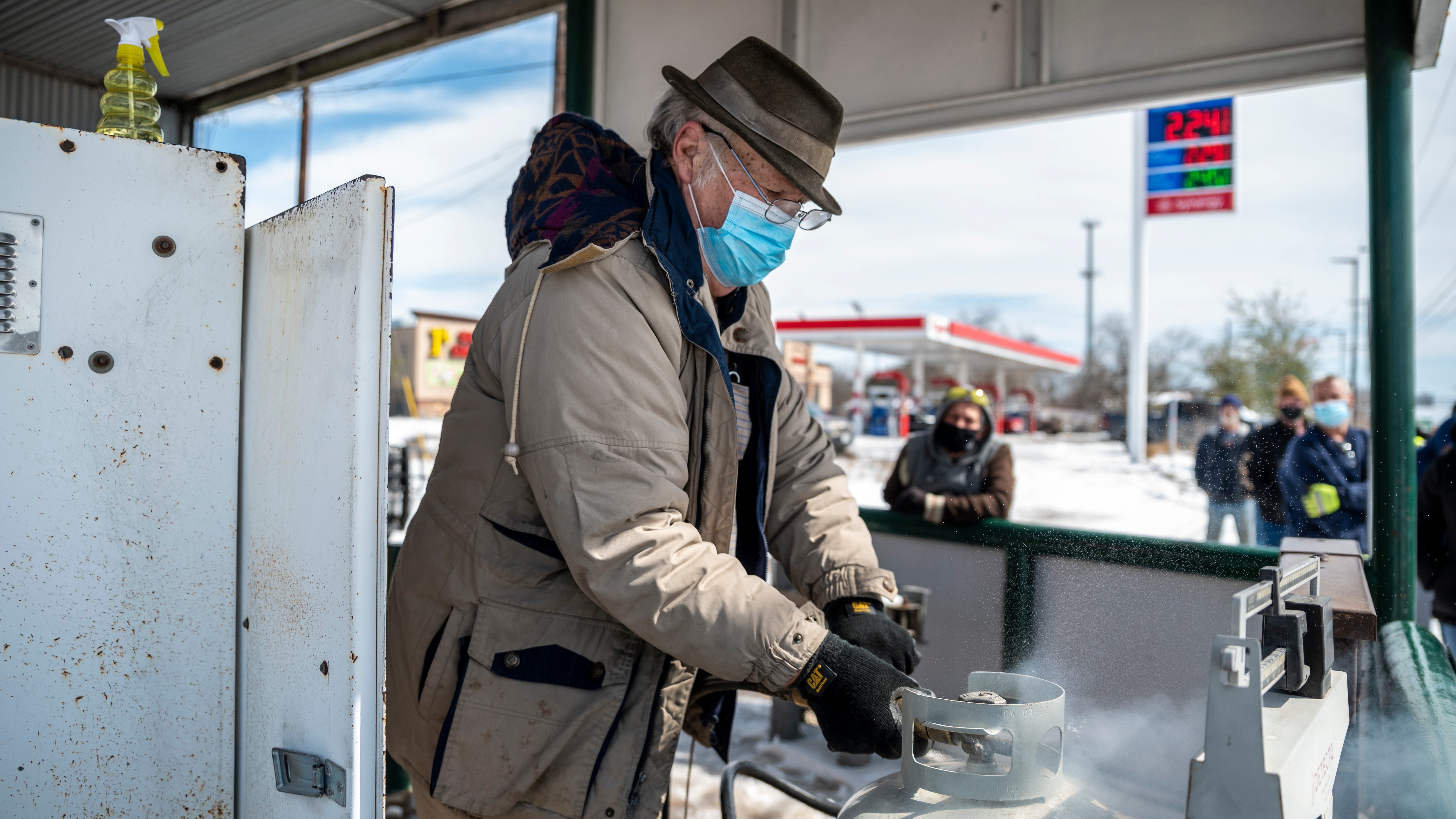 A worker fills propane tanks in Austin, TX on Tuesday, Feb. 16, 2021