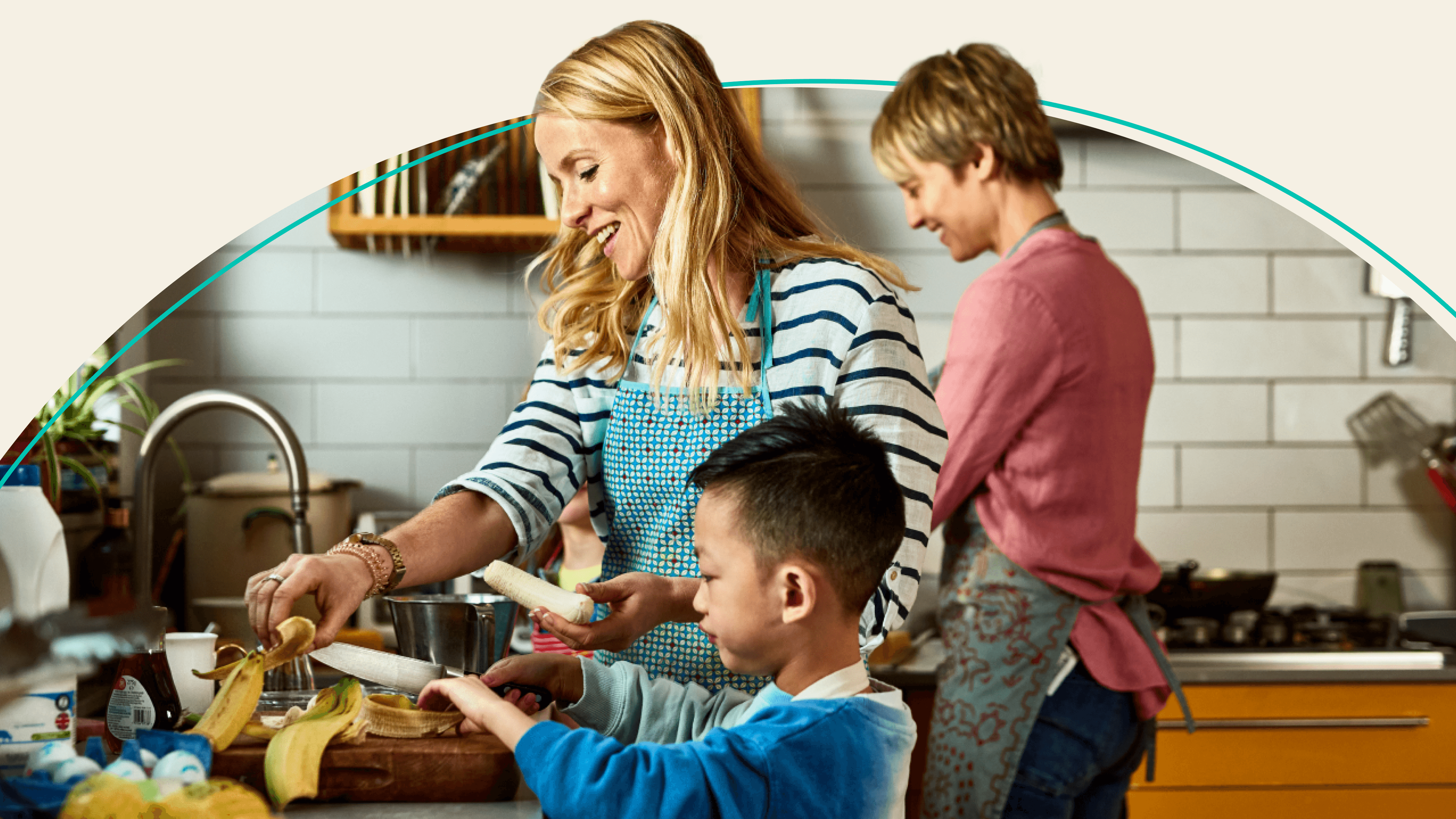 family cooking dinner in kitchen