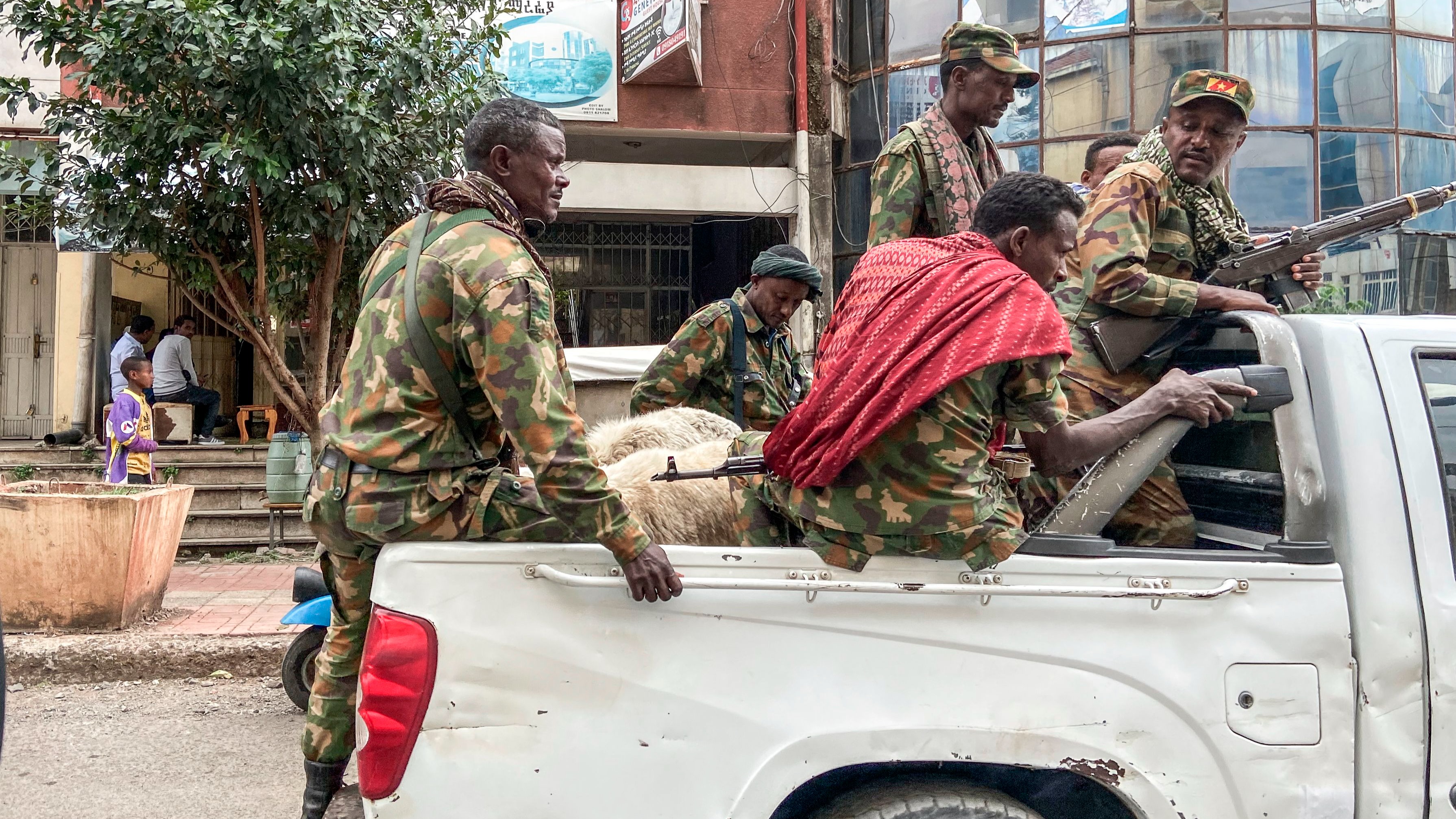 Members of the Amhara militia, that combat alongside federal and regional forces against northern region of Tigray, ride on the back of a pick up truck in the city of Gondar, on 08 November 2020.