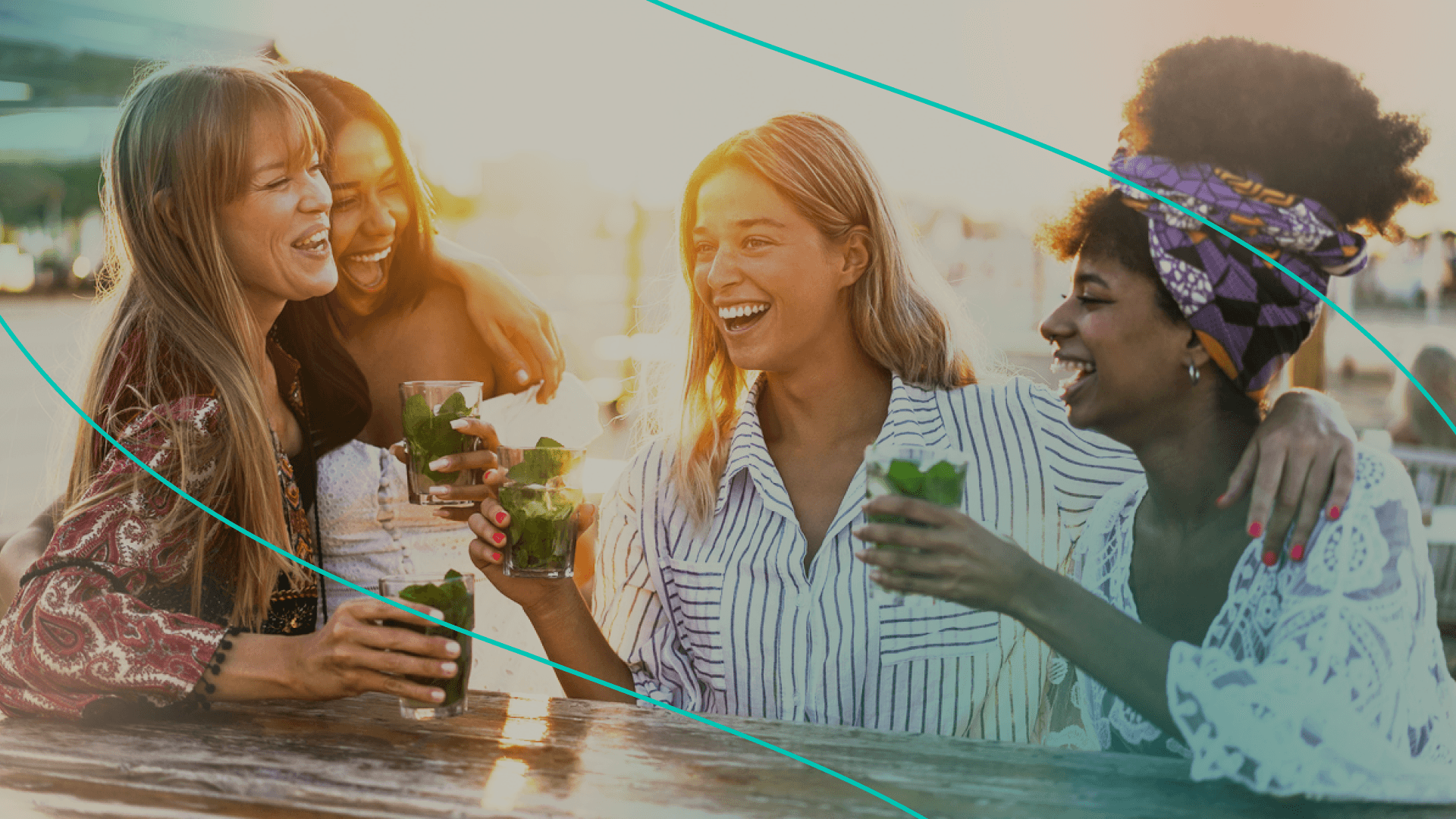 group of women smiling and drinking