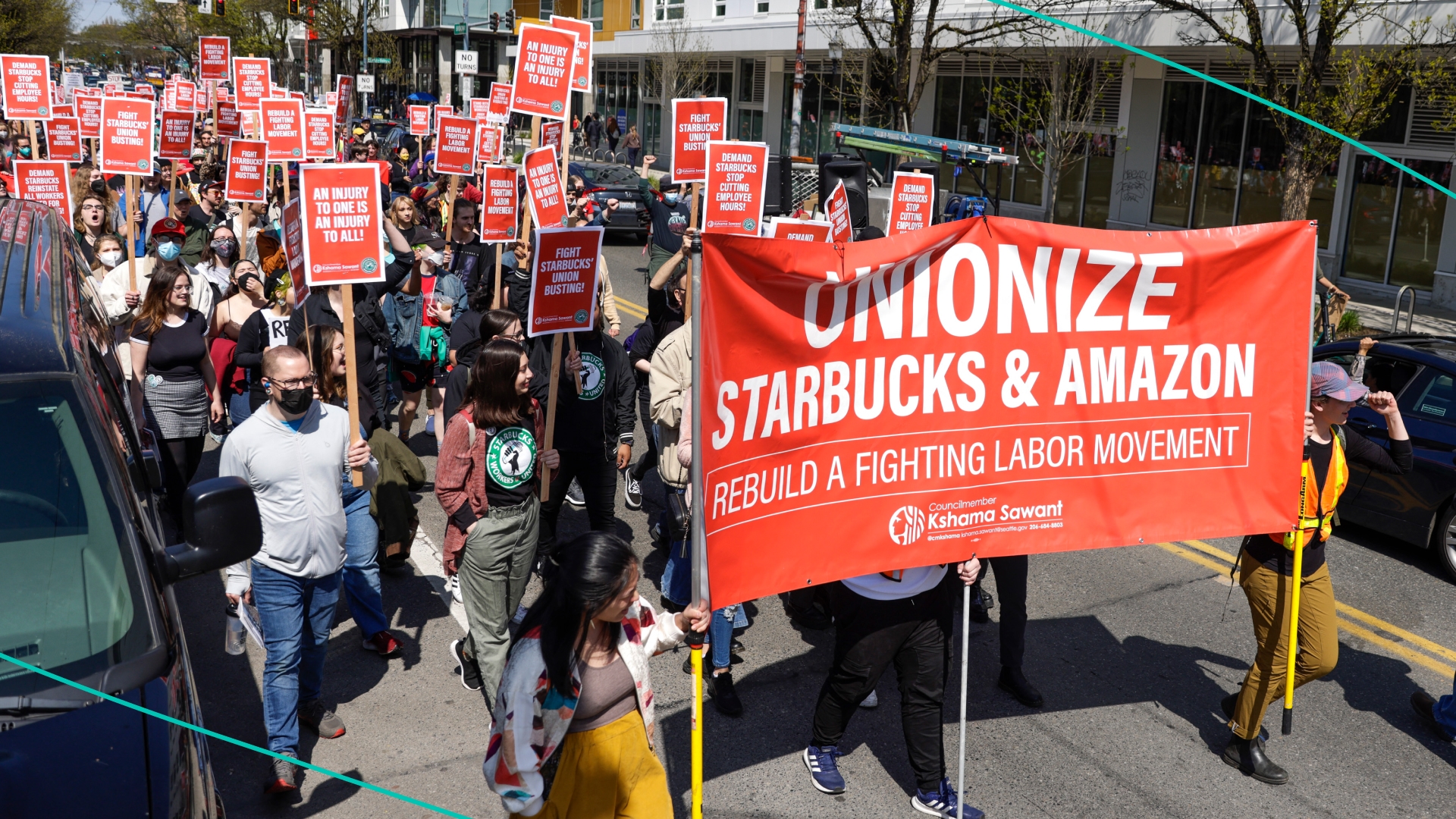 Union members and community members march in protest.