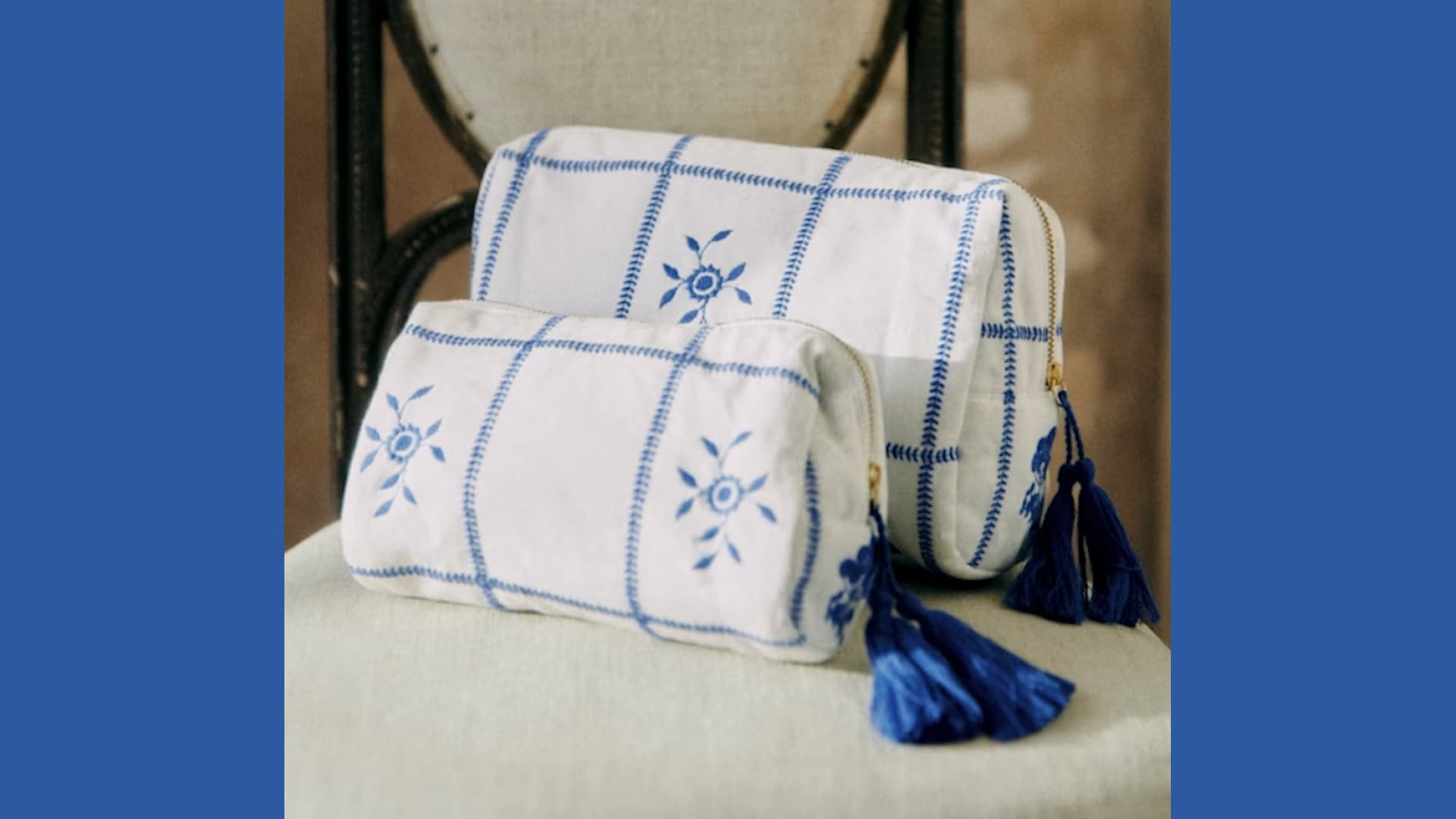 An embroidered ecru-patterned make-up bag.