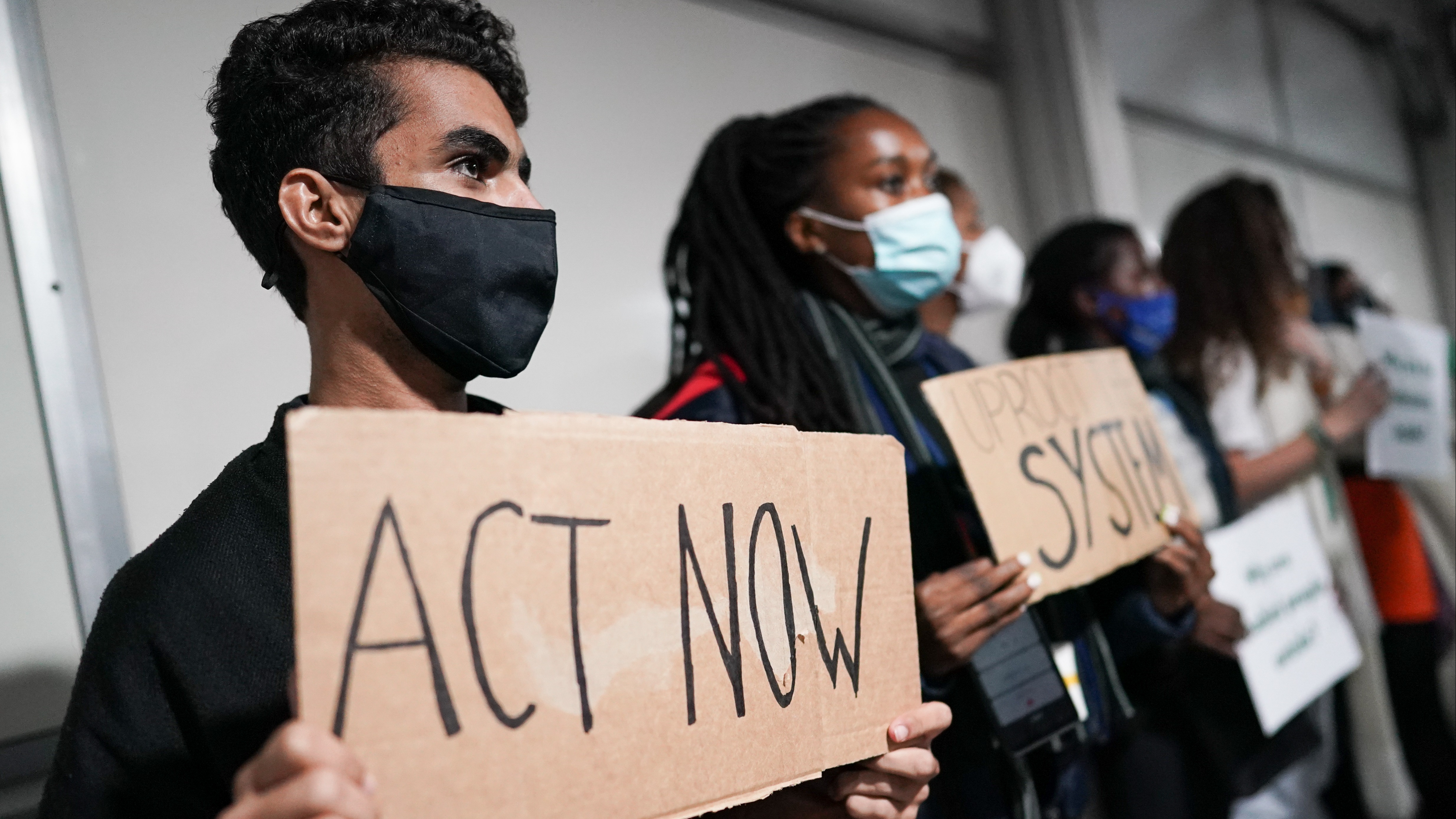 Youth Climate Activists protest as they build a human corridor