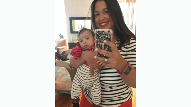 Maria Malagon at home with her son in 2017.