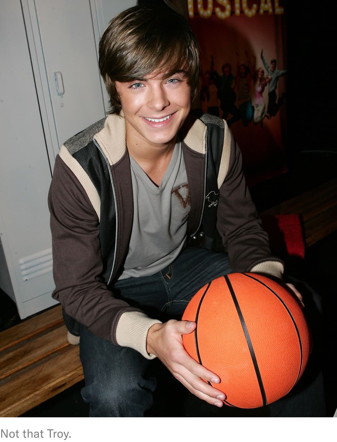 "High School Musical"-era Zac Efron holding a basketball.